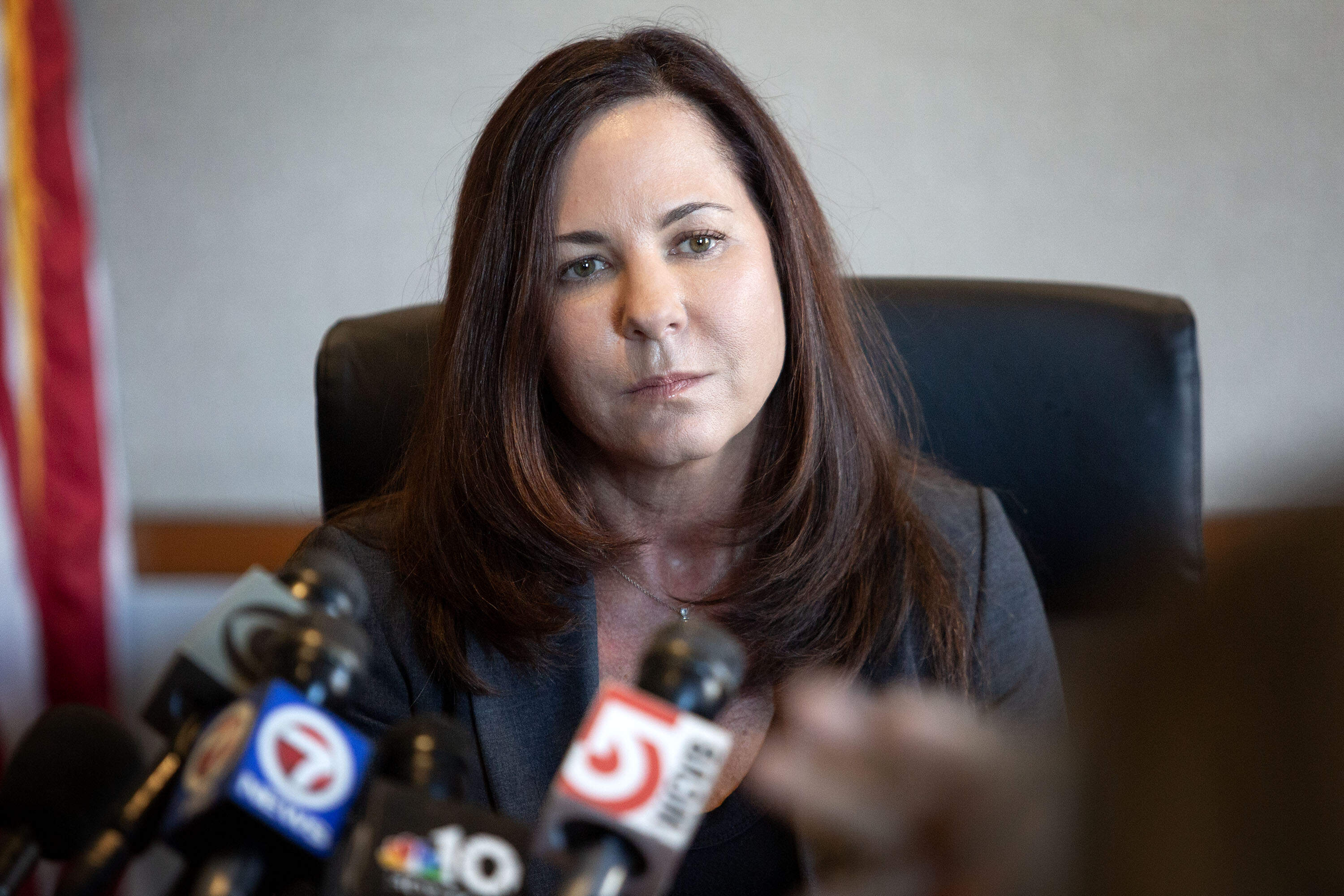 U.S. Attorney Leah Foley talks with reporters at the Moakley Federal Courthouse in Boston. (Robin Lubbock/WBUR)