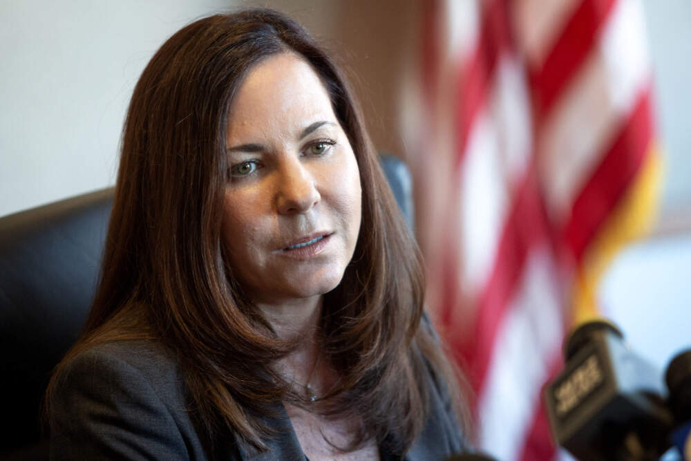 U.S. Attorney Leah Foley talks with reporters at the Moakley Federal Courthouse in Boston. (Robin Lubbock/WBUR)