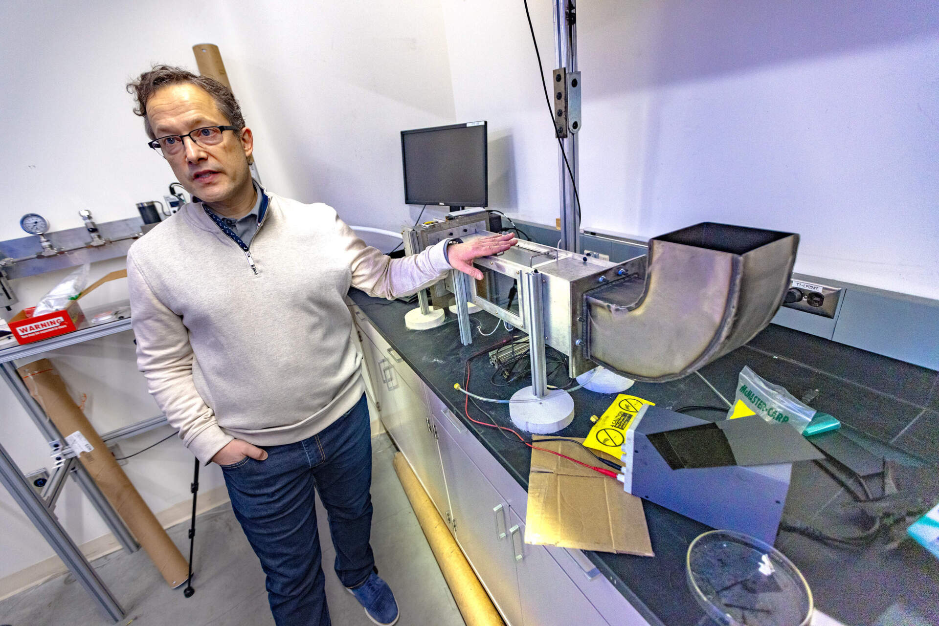 Albert Simeoni, professor and department head of the Fire Protection Engineering Department at WPI, talks about a small wind tunnel in one of the labs. (Jesse Costa/WBUR)
