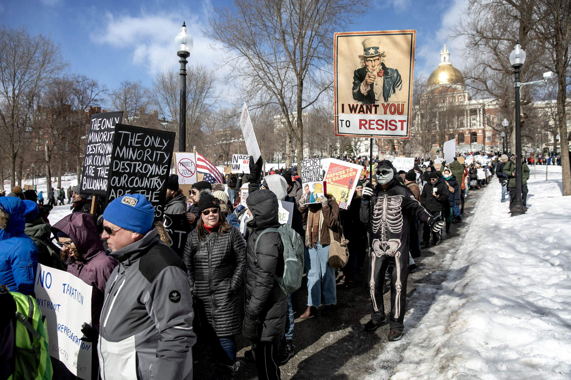 Protesters fill the walkways on Boston Common in front of the State House. (Robin Lubbock/WBUR)