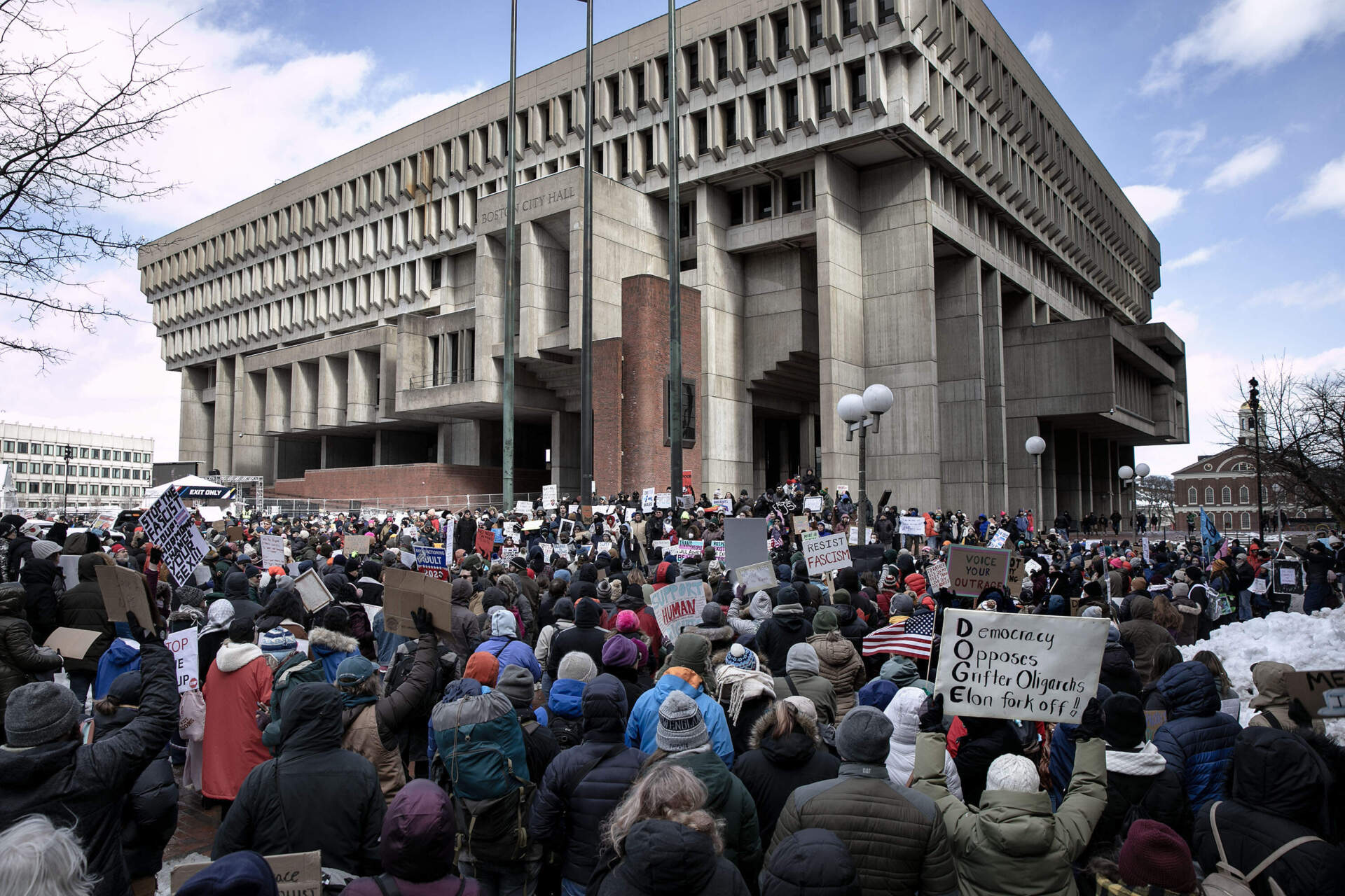 Demonstrators at the "No Kings on Presidents' Day" rally and march, protest outside Boston City Hall. (Robin Lubbock/WBUR)