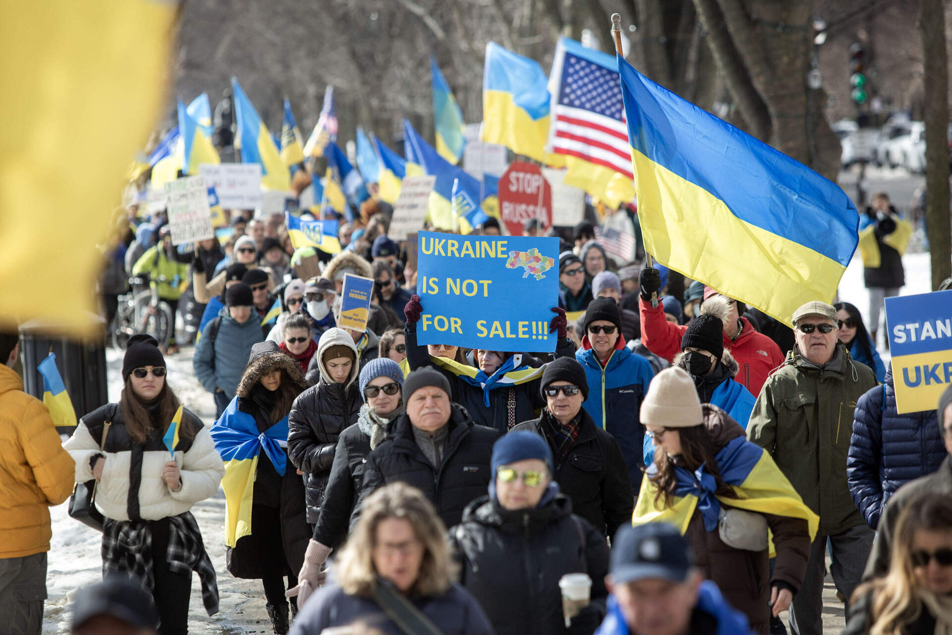 Protesters make their way along Commonwealth Ave. (Robin Lubbock/WBUR)