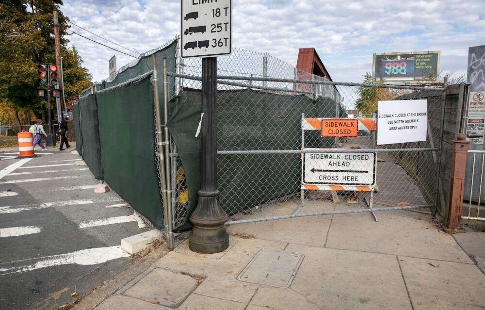 Only one sidewalk remained open on the Hyde Park River Street Bridge as repairs to the bridge continued in late 2024. (Robin Lubbock/WBUR)