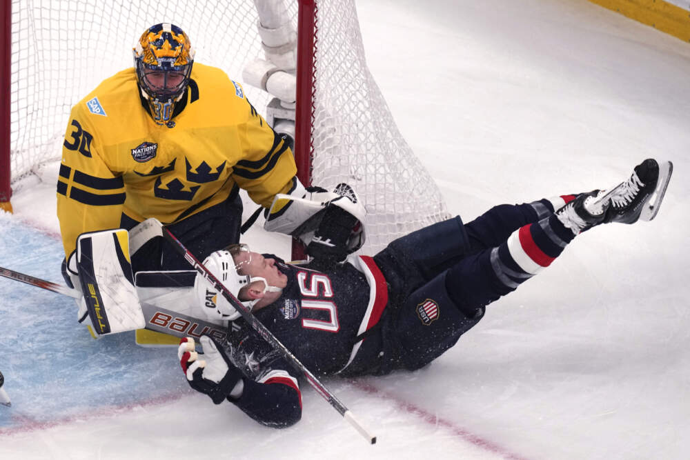 United States' Brady Tkachuk slams into the post while chasing the puck towards Sweden goaltender Samuel Ersson. (Charles Krupa/AP)
