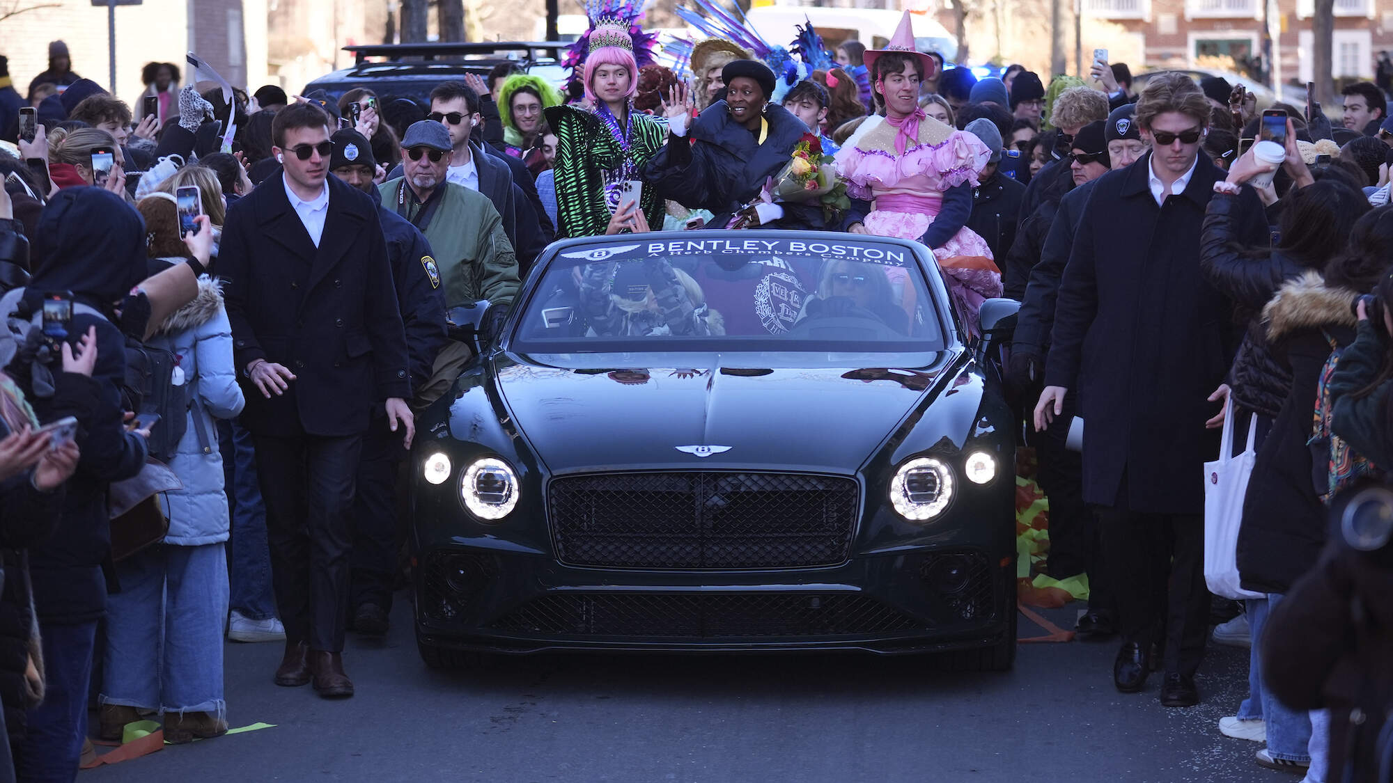 Cynthia Erivo rides with two character actors during a parade in her honor in Cambridge. (AP Photo/Charles Krupa)
