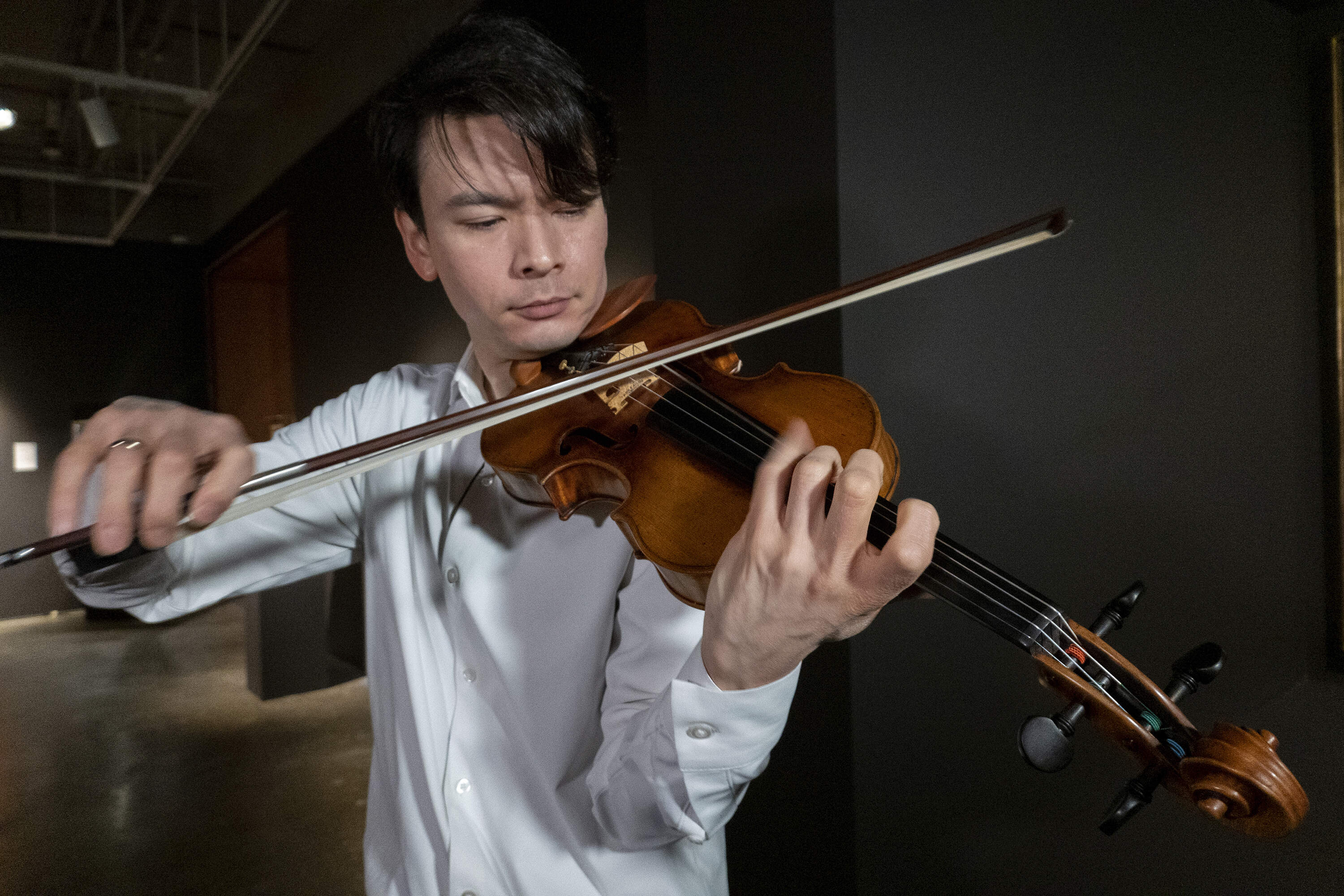Violinist Stefan Jackiw plays the 1714 Joachim-Ma Stradivarius at Sotheby's auction house in New York on Feb. 3, 2025. (AP Photo/Ted Shaffrey)