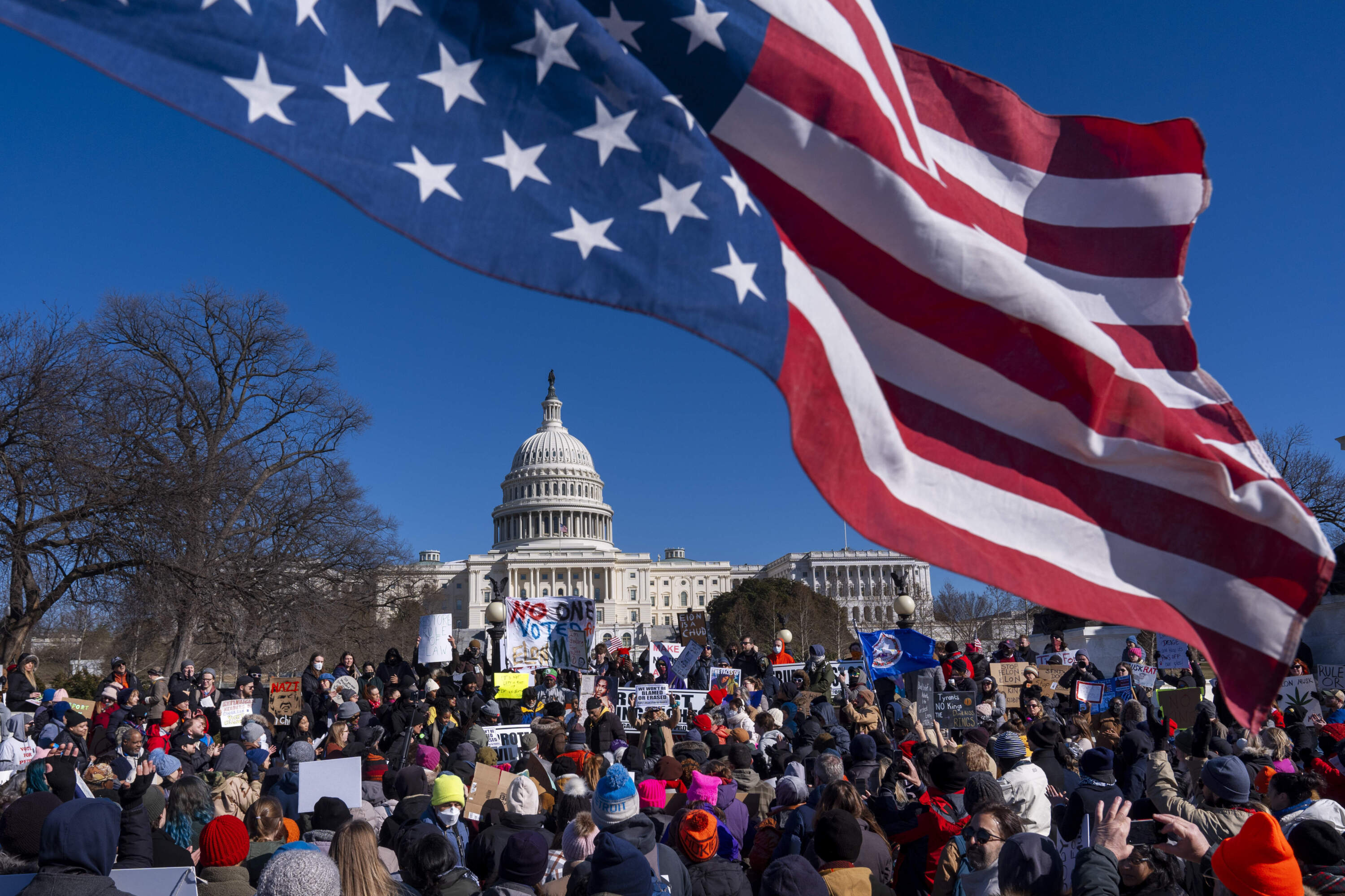 An American flag is flown upside down during the "No Kings Day" protest on President's Day in Washington, in support of federal workers and against recent actions by President Donald Trump and Elon Musk, , Monday, Feb. 17, 2025, by the Capitol in Washington. (Jacquelyn Martin/AP)