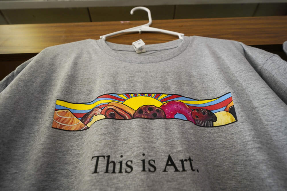 A T-shirt showing the painting displayed outside Leavitt's Country Bakery, is displayed in the store on April 13, 2023. (Robert F. Bukaty/AP)