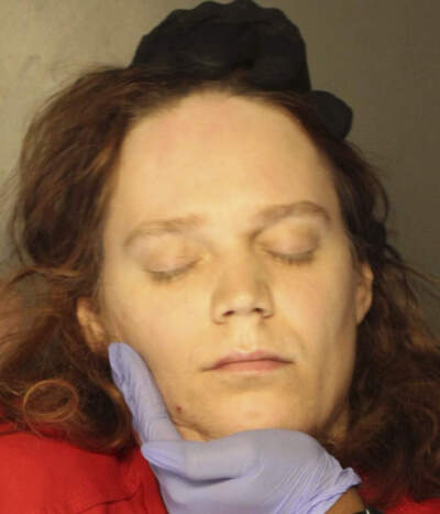 In this booking photo provided by the Delaware County, Pennsylvania, District Attorney's Office, Jack LaSota refused to speak and kept her eyes closed while being photographed after being detained in a hotel in suburban Pennsylvania on Jan. 23, 2023. (Delaware County, Pennsylvania, District Attorney's Office via AP)