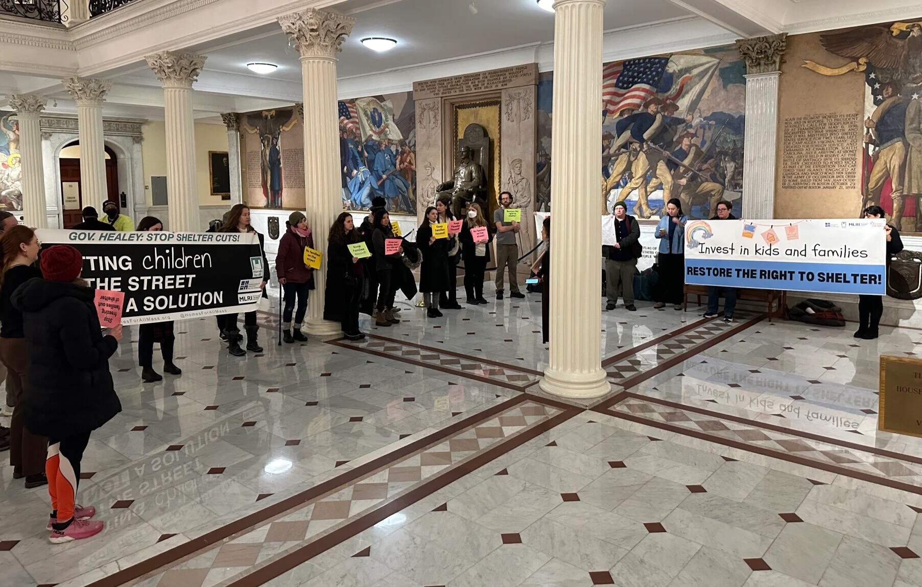 Protesters gather outside the House Chamber on Feb. 6, 2025 rallying against proposed reforms to the emergency assistance shelter system. (SHNS)