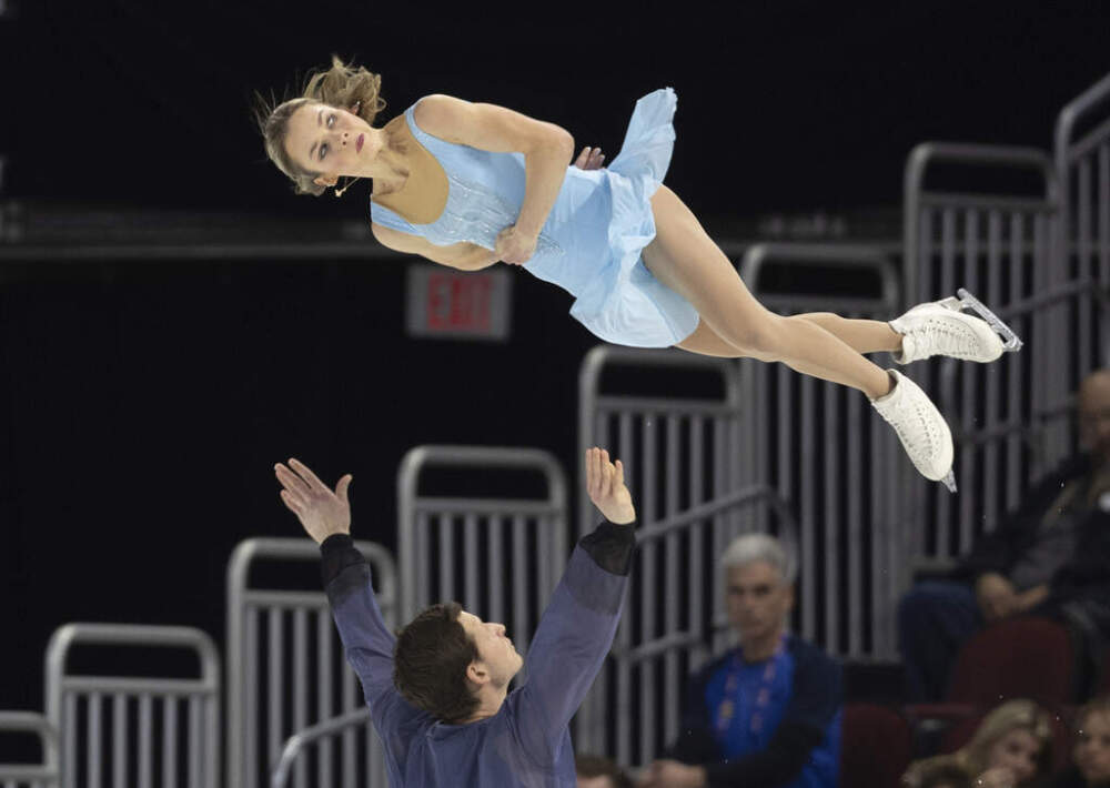 Misha Mitrofanov launches Alisa Efimova into the air during the pairs free dance competition at the U.S. figure skating championships on Jan. 25 in Wichita, Kansas. (Travis Heying/AP)