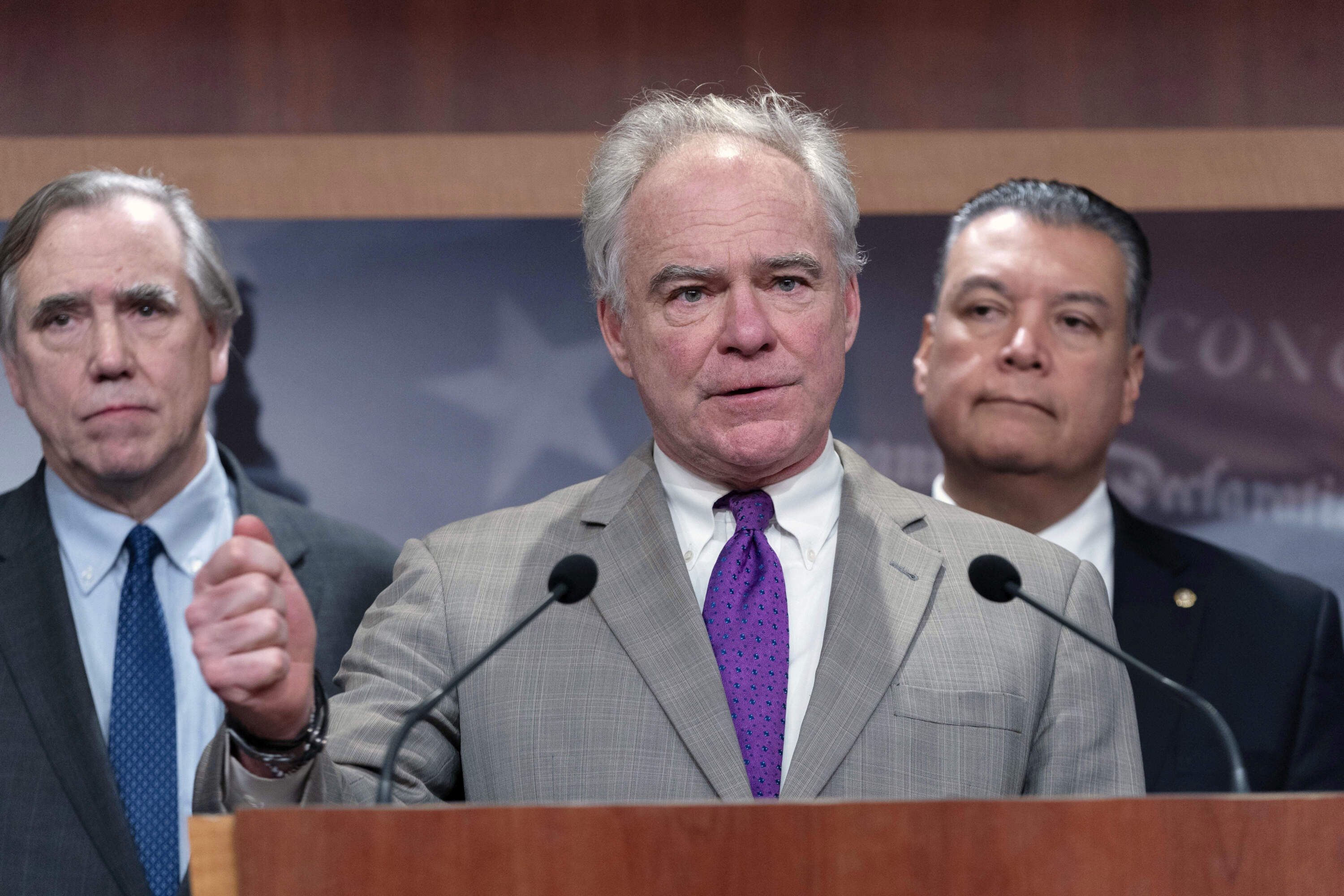 Sen. Tim Kaine, D-Va., flanked by Sen. Jeff Merkley, D-Ore., left, and Sen. Alex Padilla, D-Calif., speaks during a news conference on Russ Vought's nomination at the Capitol in Washington, Thursday, Jan. 30, 2025. (Jose Luis Magana/AP)