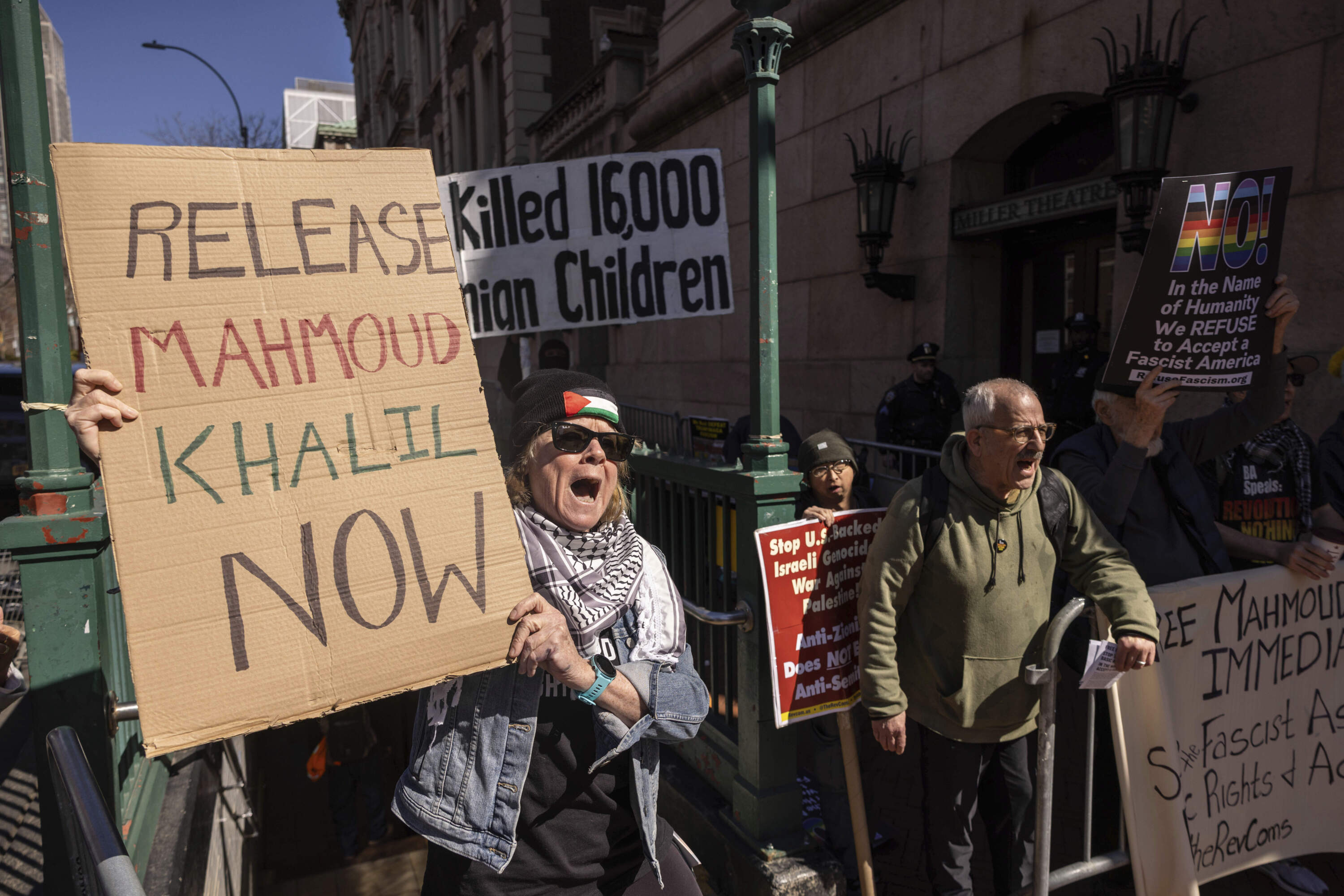 A protester raises signs during a demonstration in support of Palestinian activist Mahmoud Khalil outside Columbia University, Monday, March 10, 2025, in New York. (Yuki Iwamura/AP)