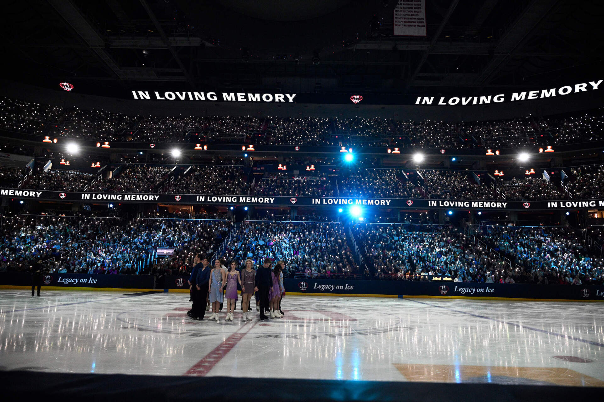 Skaters stand at center ice Sunday, March 2, 2025, at the Legacy on Ice event. (Nick Wass/AP)