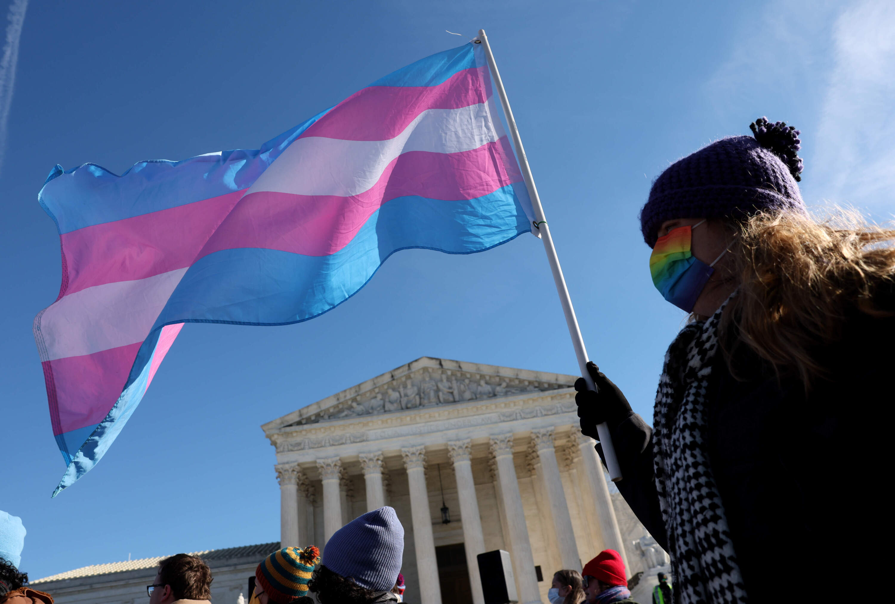 A transgender rights supporter takes part in a rally outside of the U.S. Supreme Court as the high court hears arguments in a case on transgender health rights on December 04, 2024 in Washington, D.C. (Kevin Dietsch/Getty Images)
