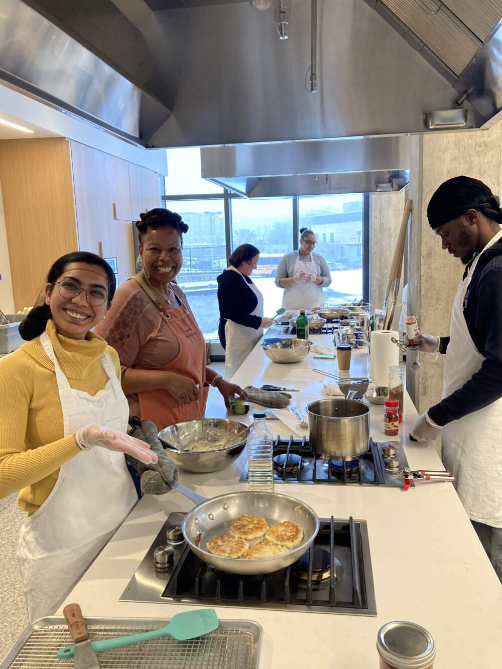 BPL Chef-in-Residence Glorya Fernandez and participants in one of her classes at BPL's Nutrition Lab in Roxbury. (Courtesy of the Boston Public Library)