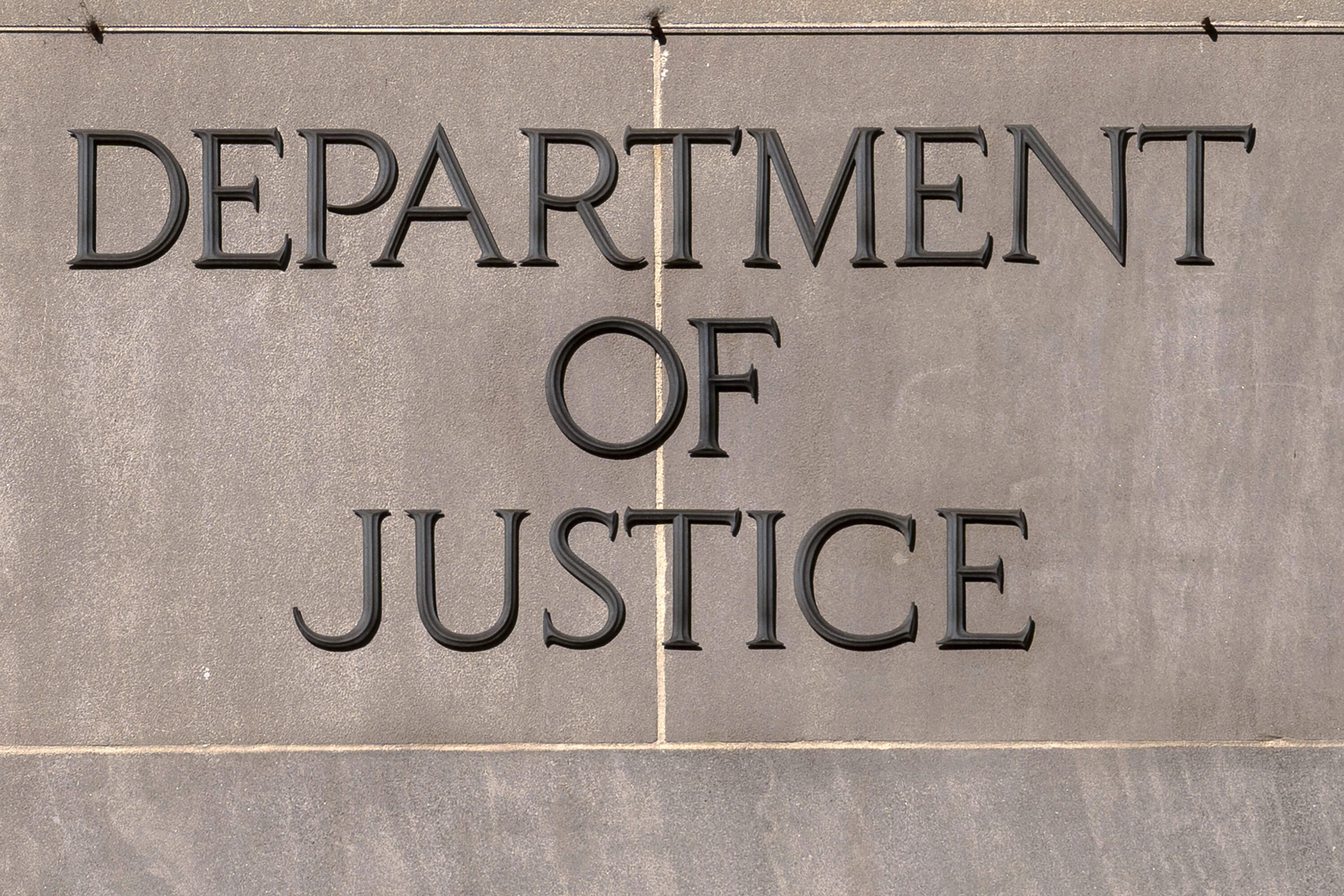A sign of the U.S. Department of Justice is seen on the headquarters building in Washington, Monday, Nov. 18, 2024. (Jose Luis Magana/AP)