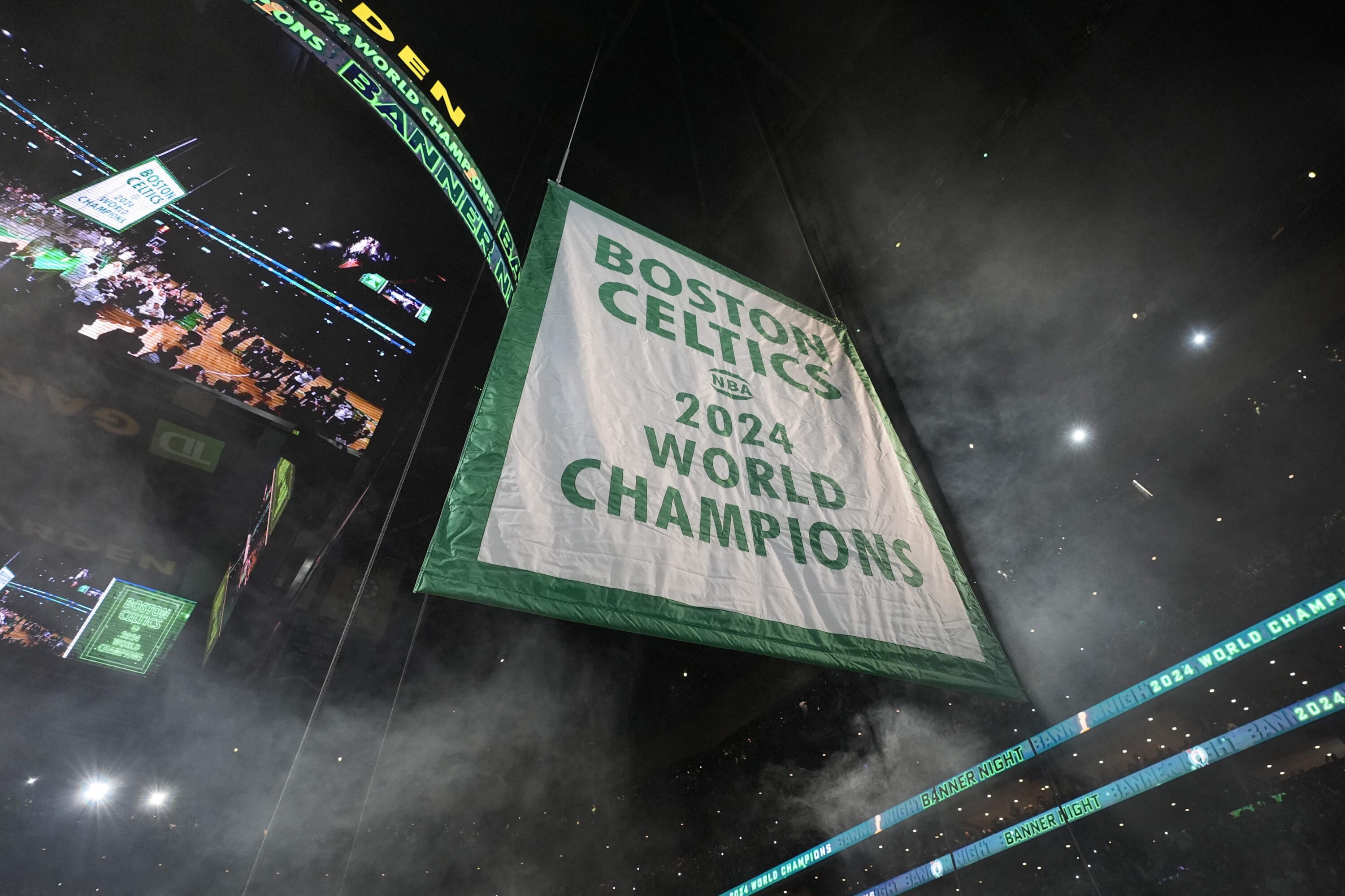 The Celtics' 2024 NBA championship banner rises during a ceremony last October at the TD Garden. (Charles Krupa/AP)
