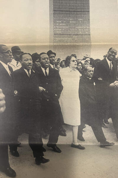 A photo published in The Northeastern Edition in the 1980s shows Dr. Martin Luther King Jr. marching with other community leaders in Boston in 1965. (Courtesy Northeastern University Archives via Arielle Gray/WBUR)