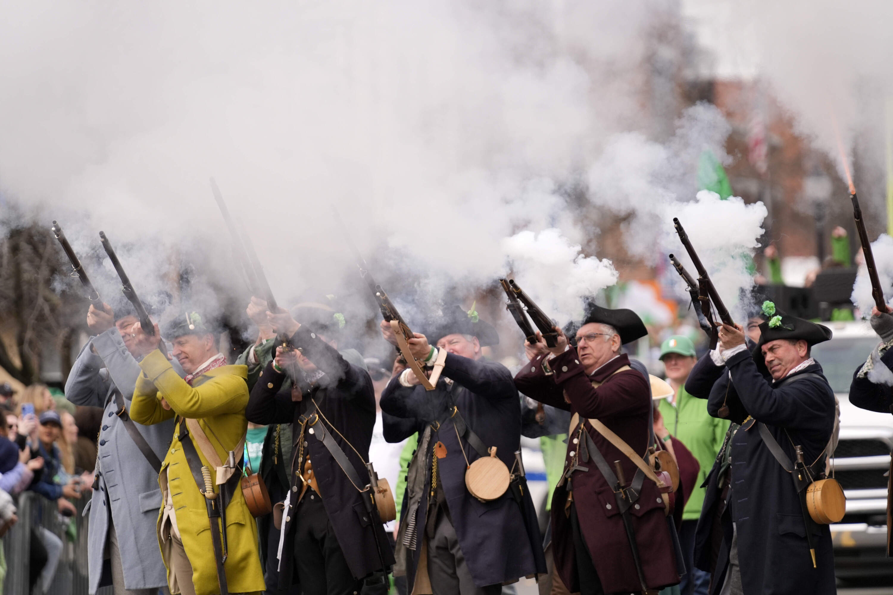 Performers shoot muskets at the St. Patrick's Day parade. (Robert F. Bukaty/AP)
