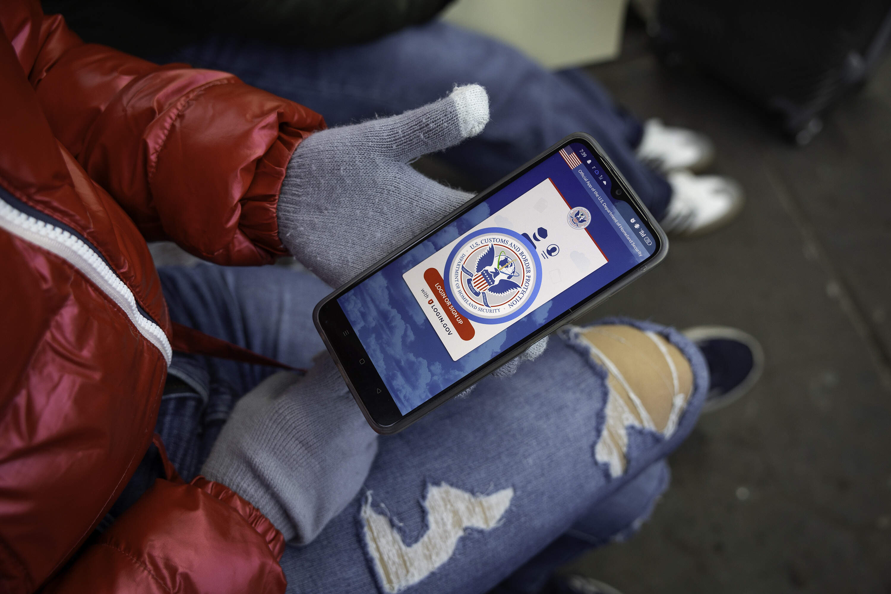 An immigrant from Venezuela tries in vain to access the CBP One app a day after the second inauguration of President Trump on Jan. 21 in Nogales, Mexico. (John Moore/Getty Images)