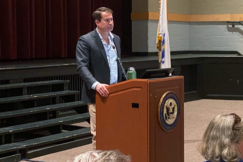 Massachusetts Congressman Seth Moulton speaks to a packed crowd in Boxford, Mass. Saturday. (Deborah Becker/WBUR)
