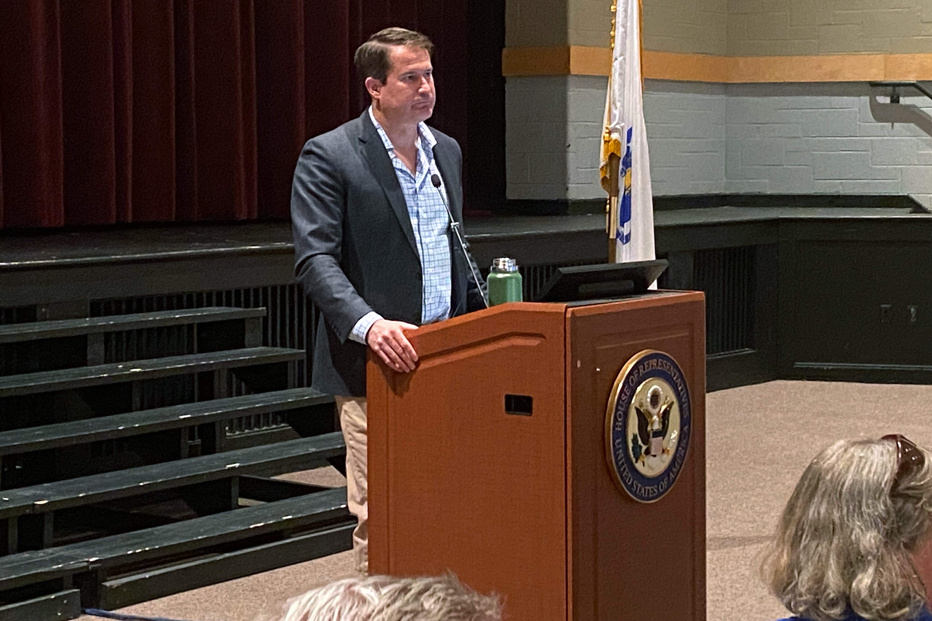 Massachusetts Congressman Seth Moulton speaks to a packed crowd in Boxford, Mass. Saturday. (Deborah Becker/WBUR)