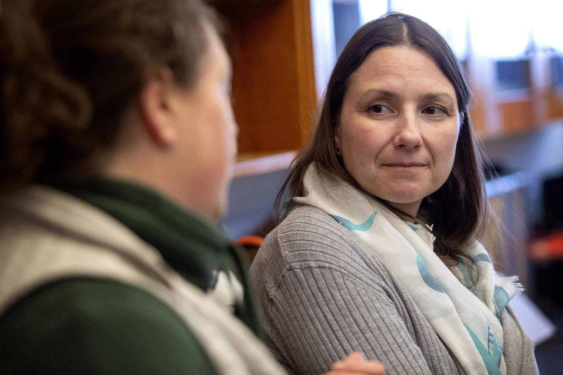 Adrienne Pappal, from the Massachusetts Office of Coastal Zone Management, talks with Kristin Osborne at the Massachusetts Maritime Academy. (Robin Lubbock/WBUR)