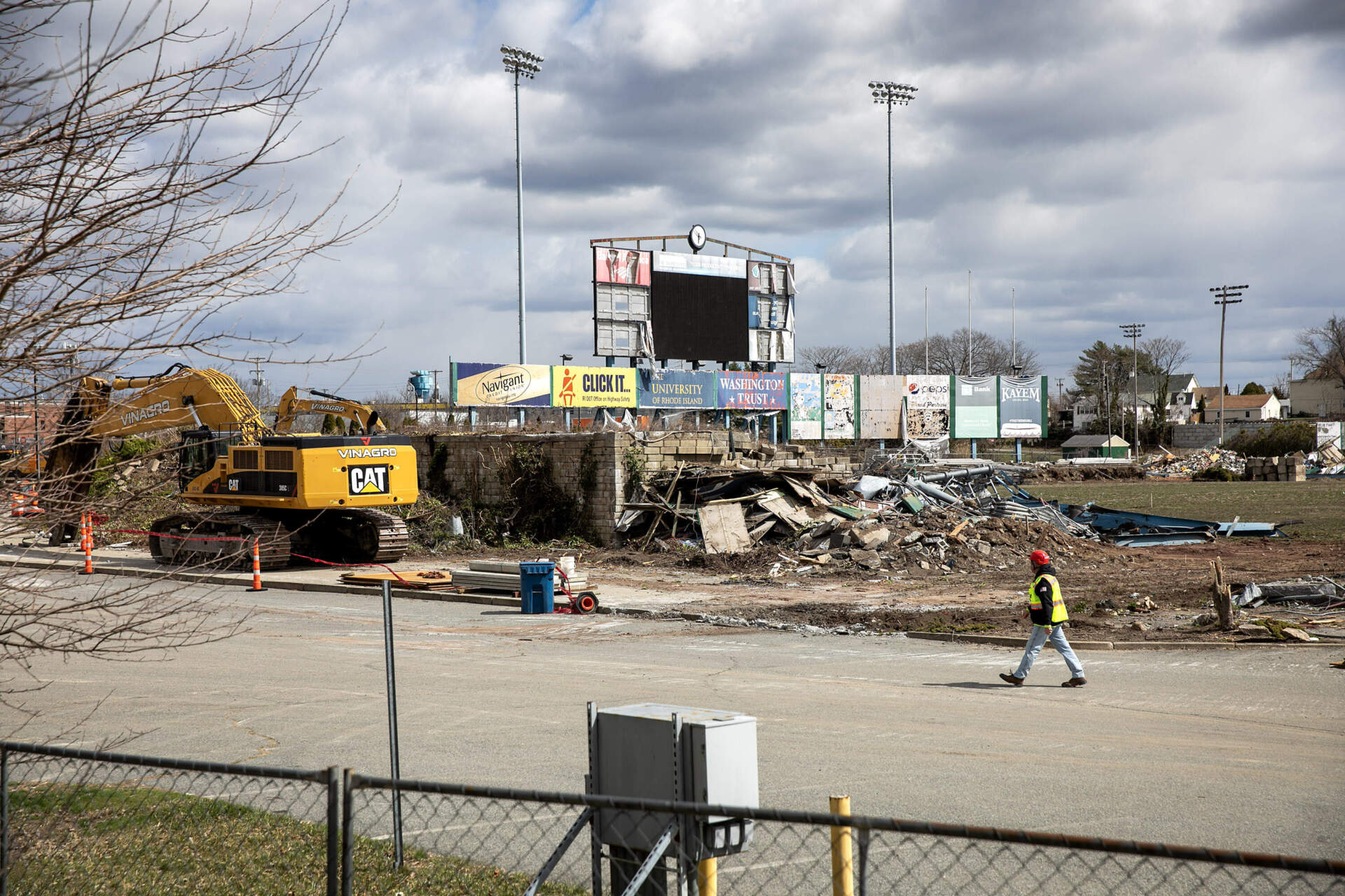 The scoreboard at stands near heaps of rubble. (Robin Lubbock/WBUR)