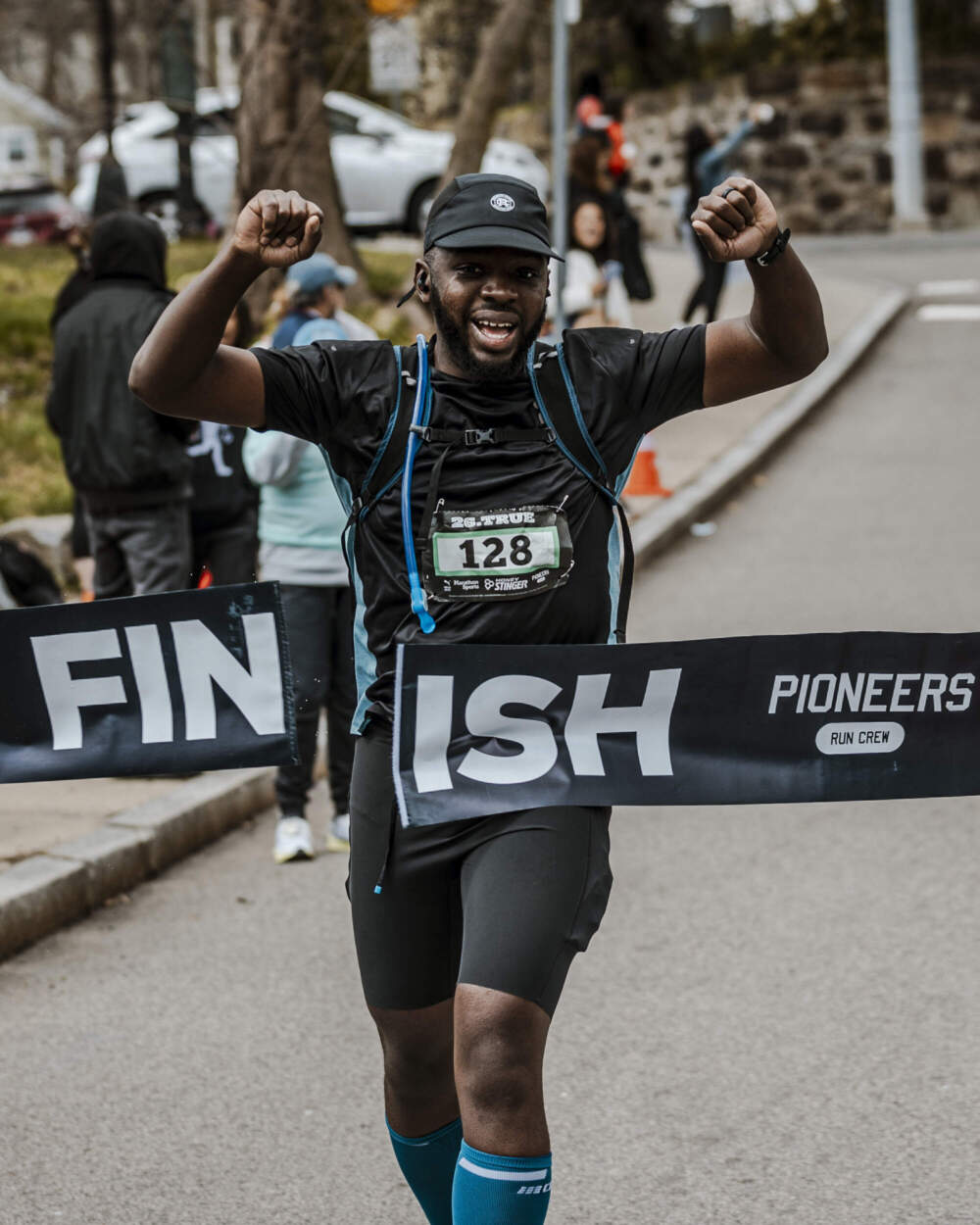 A runner breaking the tape at the finish line of the 26.TRUE marathon last year. (Courtesy George Grullon)