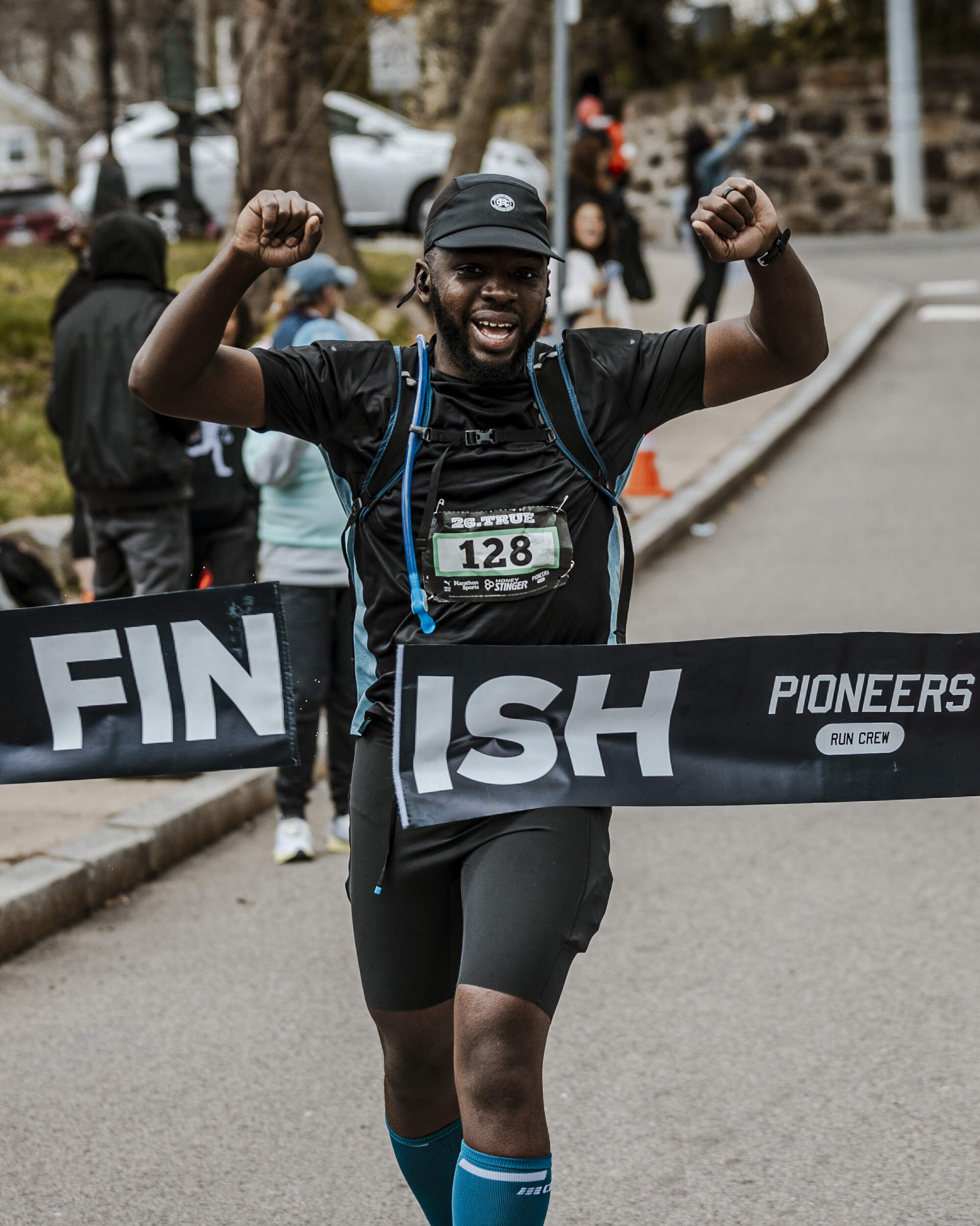 A runner breaking the tape at the finish line of the 26.TRUE marathon last year. (Courtesy George Grullon)