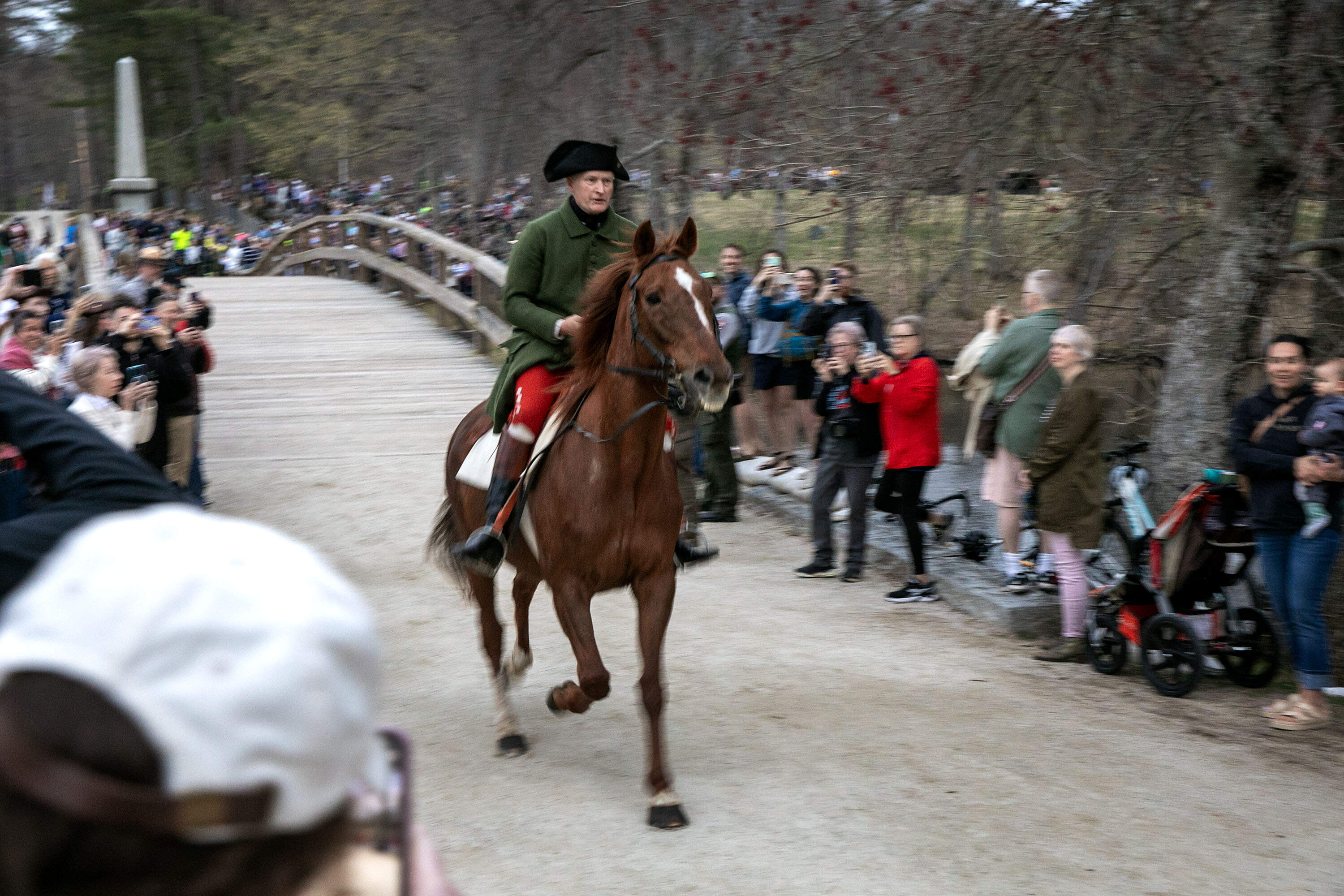 At 6 a.m. Dr. Samuel Prescott arrives from Monument Street and crosses The Old North Bridge to spread the word that British were on their way to Concord. (Robin Lubbock/WBUR)