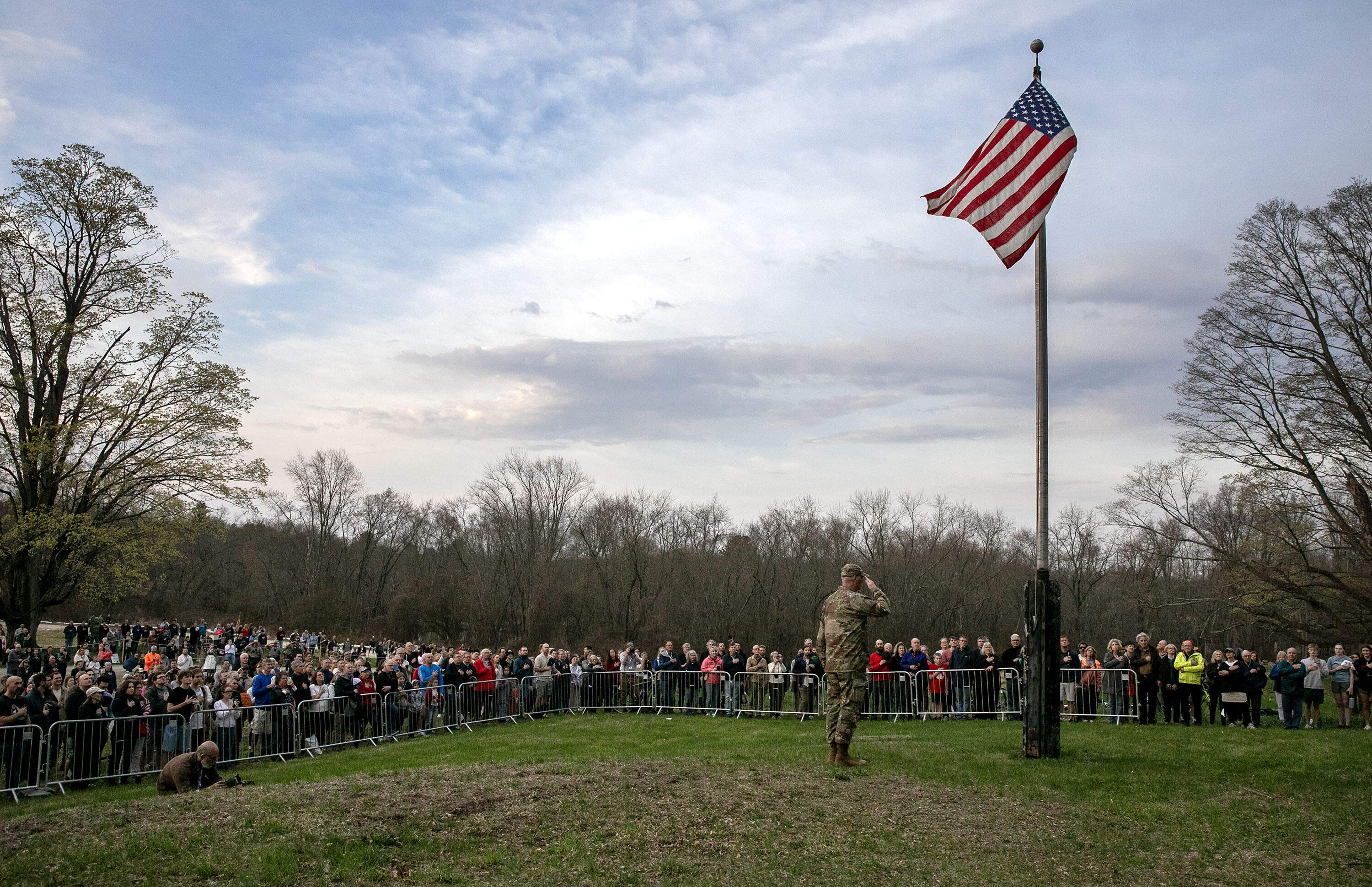 The dawn salute at Buttrick Hillside at the start of Concord's commemoration the 250th anniversary of the Battle of Concord. (Robin Lubbock/WBUR)