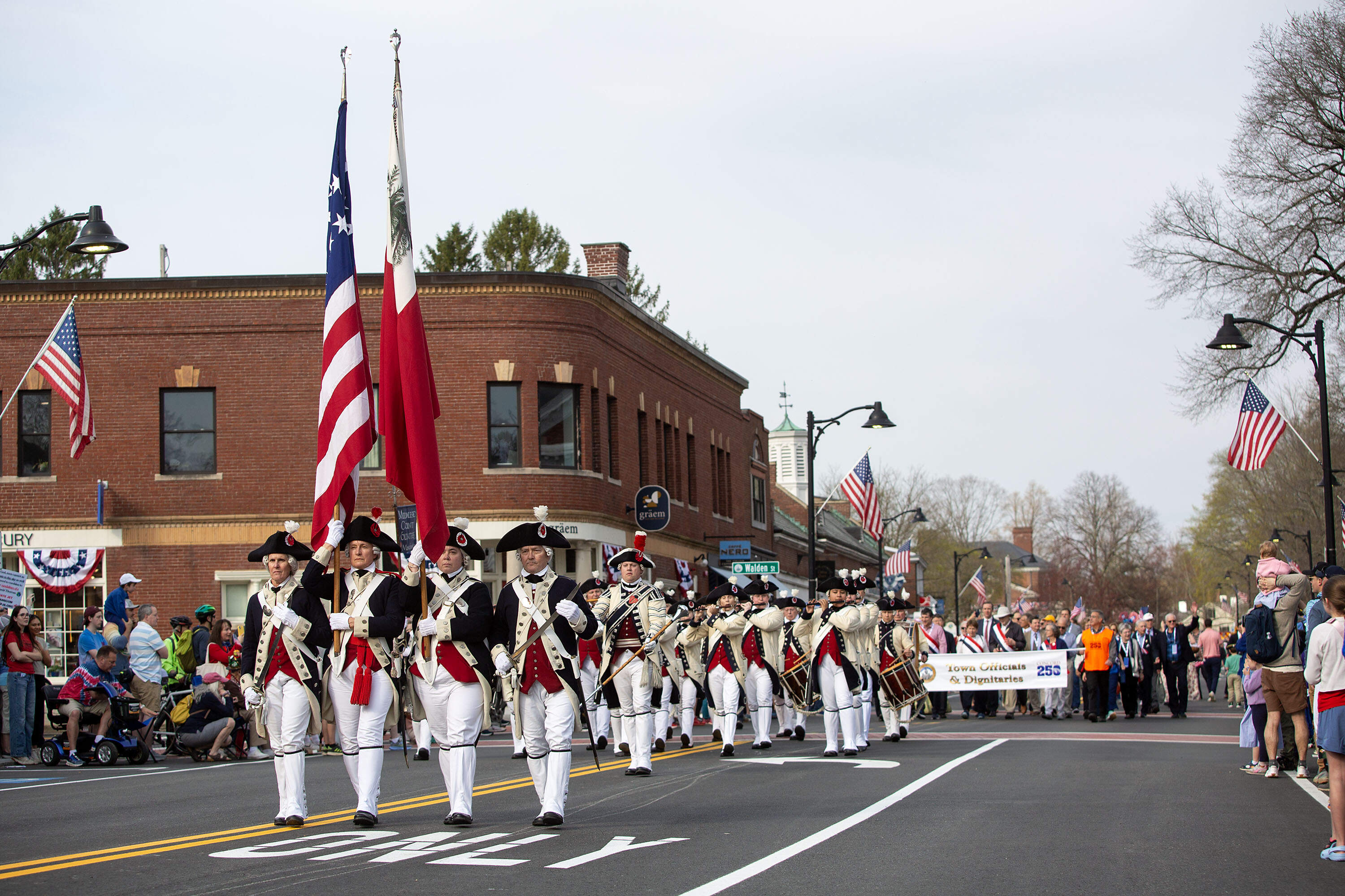The Middlesex Country Volunteers march along Main Street in the parade for the 250th anniversary commemoration of the Battle of Concord. (Robin Lubbock/WBUR)