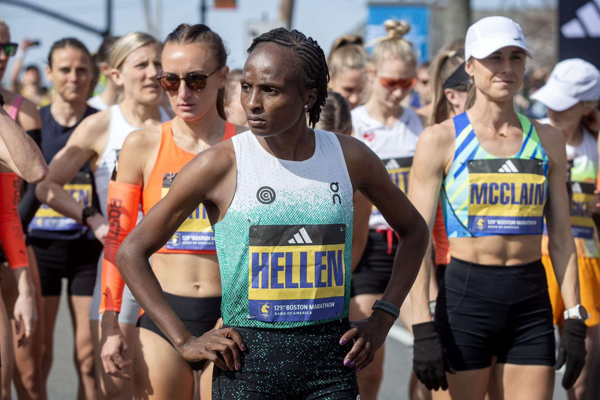 Defending two-time champ Hellen Obiri waits for the starting gun on the starting line of the 129th Boston Marathon. (Robin Lubbock/WBUR)