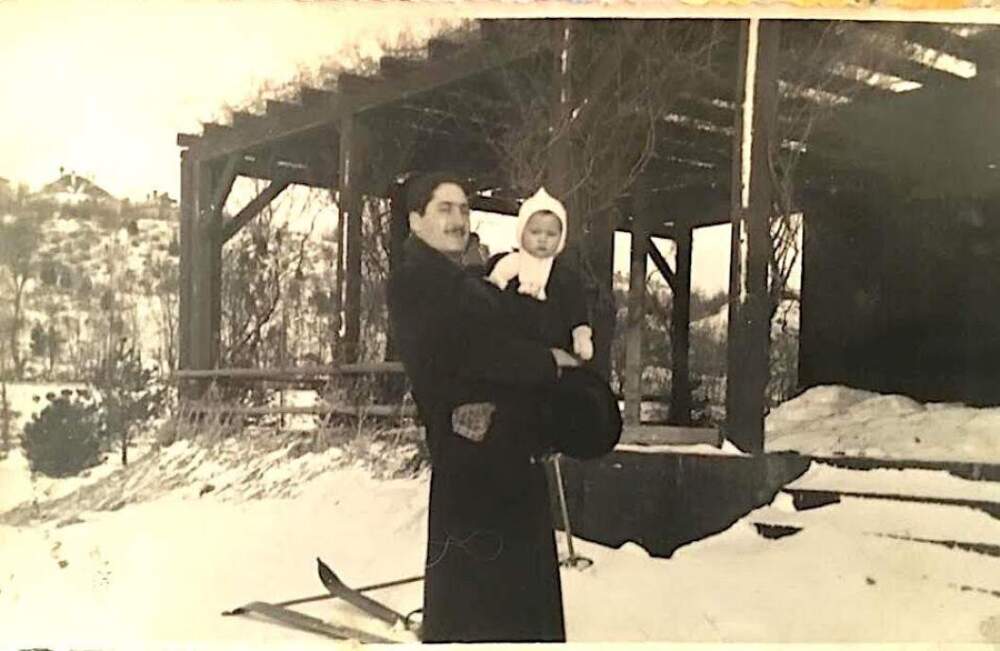 The author's father, Haim, being held by his grandfather, Alexander, circa 1938. (Courtesy Julie Brill)