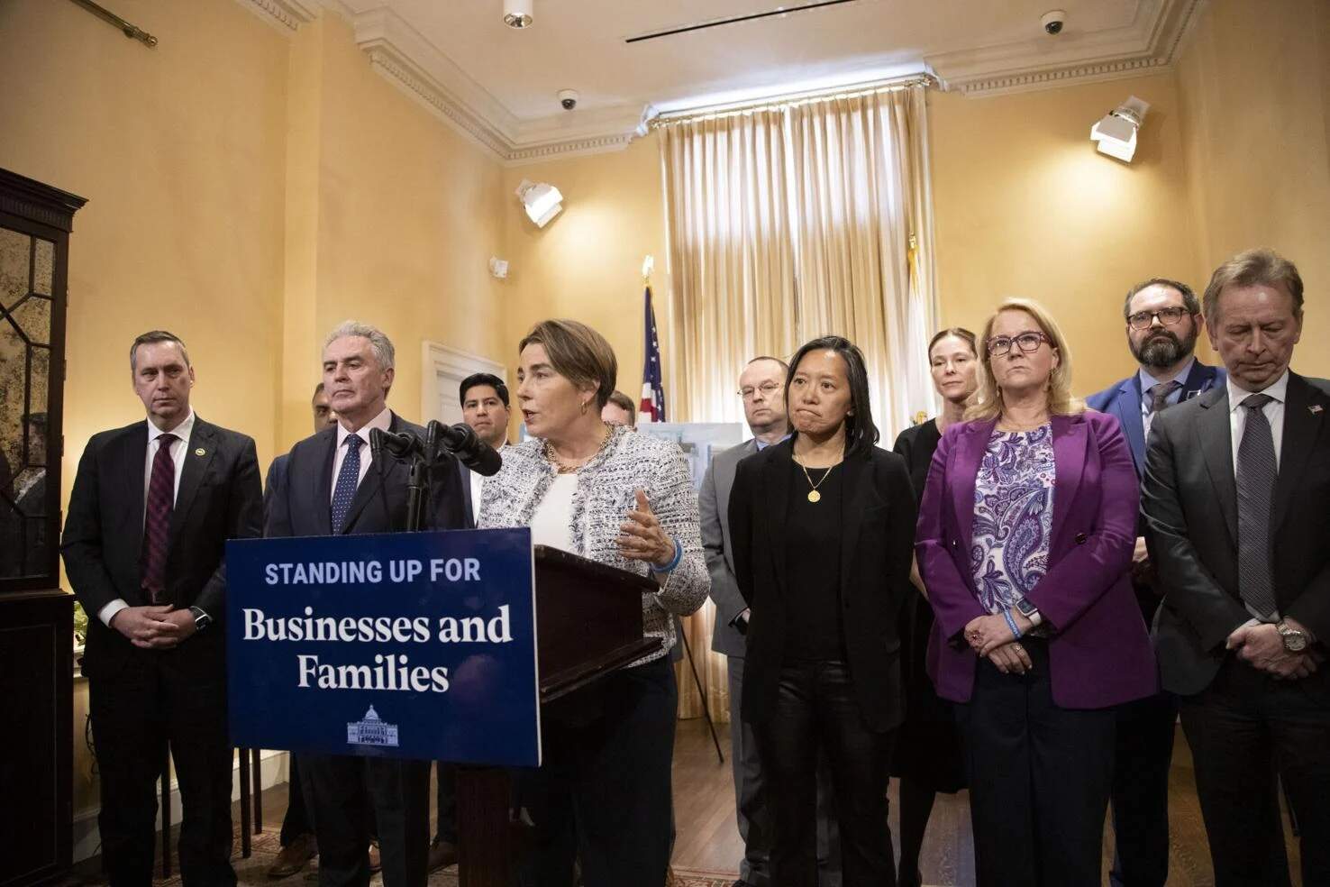 Gov. Maura Healey, flanked by Cabinet secretaries and business leaders, speaks with reporters following a closed-door roundtable discussion about tariffs on April 9, 2025. (Chris Lisinski/SHNS)