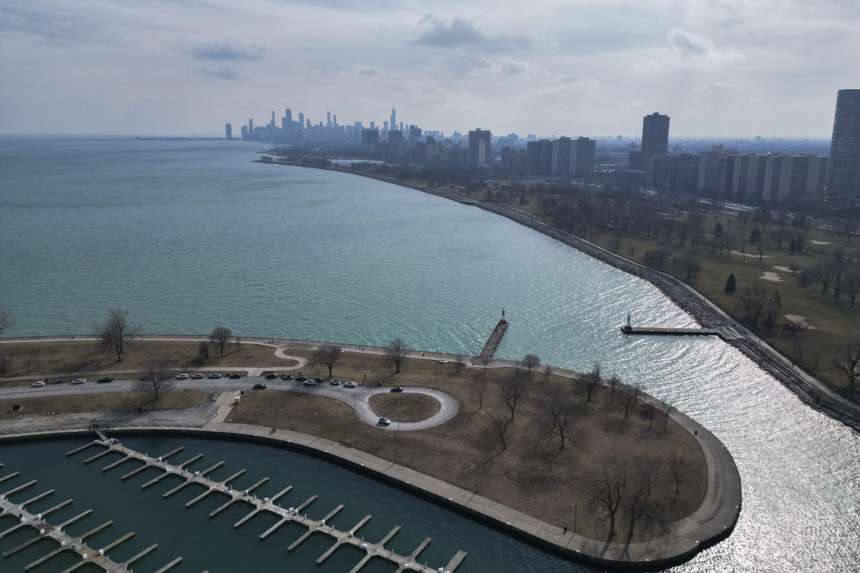 Sunlight reflects off of Lake Michigan at Montrose Harbor on an unseasonably warm day, Tuesday, Feb. 27, 2024, in Chicago. (Erin Hooley/AP)