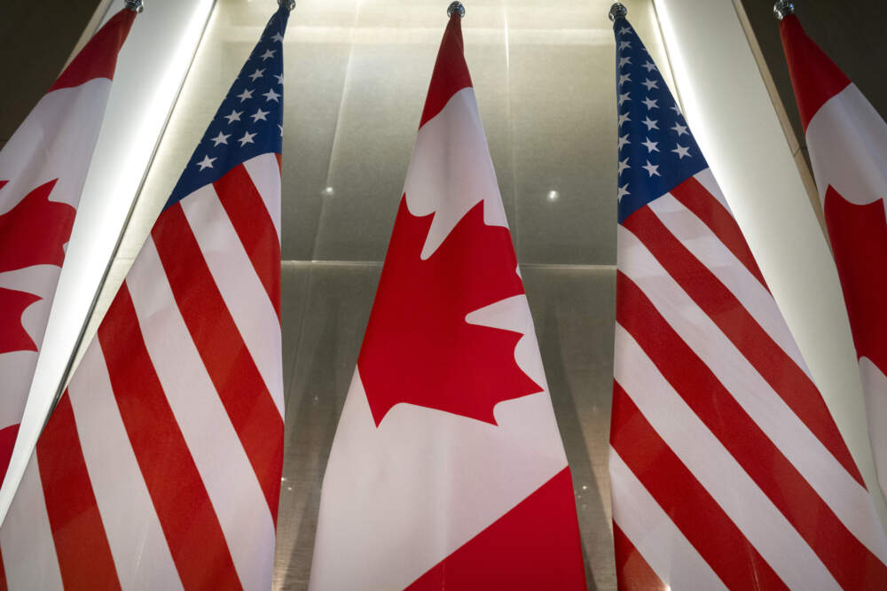 U.S. and Canadian flags are displayed before an event with Ontario Premier Doug Ford and the U.S. Chamber of Commerce, Tuesday, Feb. 11, 2025, in Washington. (Mark Schiefelbein/AP)