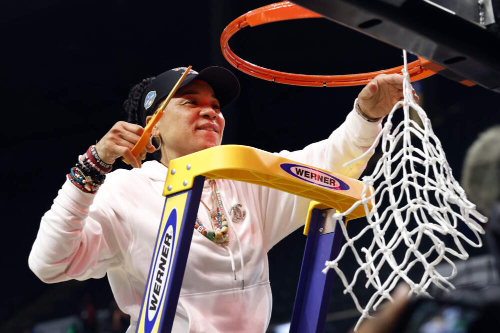 South Carolina head coach Dawn Staley cuts down the net after defeating Duke to advance to the Final Four in the Elite Eight of the NCAA college basketball tournament, Sunday, March 30, 2025, in Birmingham, Ala. (AP Photo/Butch Dill)