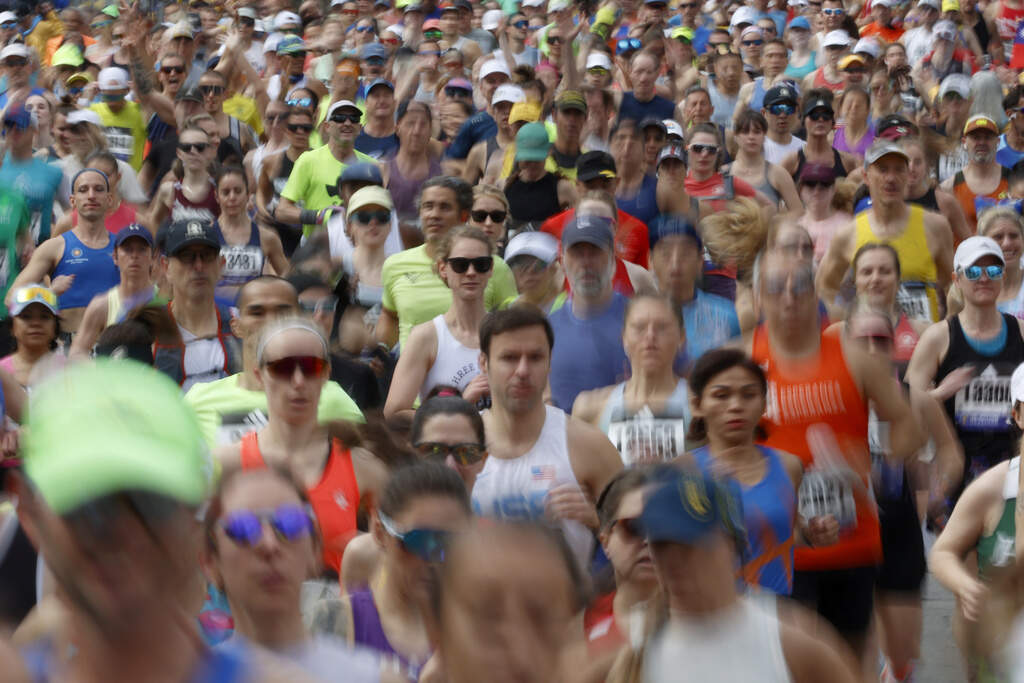 A wave a runners set out from the start of the Boston Marathon in 2024. (Mary Schwalm/AP)