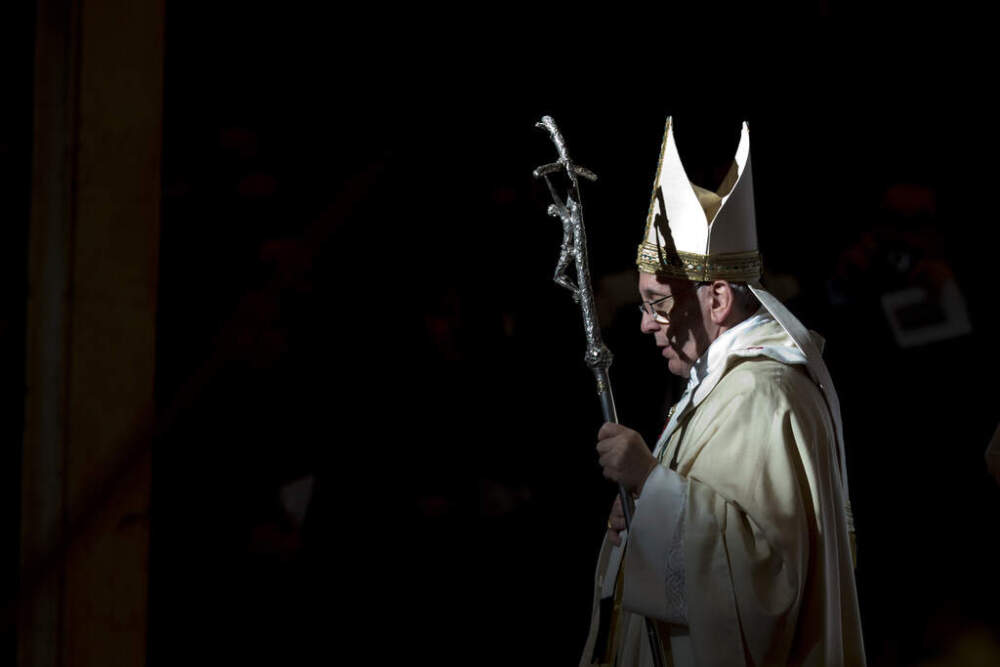 Pope Francis holds the pastoral staff as he leaves after celebrating a Mass in St. Peter's Basilica, at the Vatican, to mark Epiphany, Monday, Jan. 6, 2014. (Andrew Medichini/AP)