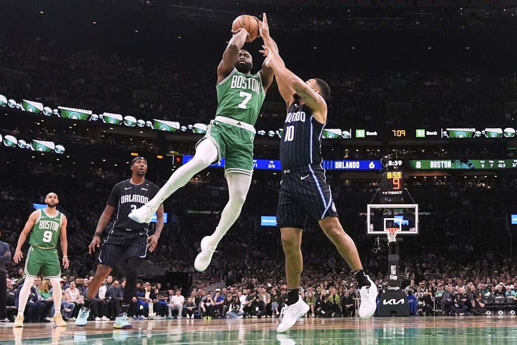 Boston Celtics guard Jaylen Brown (7) takes a shot while pressured by Orlando Magic guard Cory Joseph (10) during the first half in Game 2 of a first-round NBA playoff series, Wednesday, April 23, 2025, in Boston. (Charles Krupa/AP)
