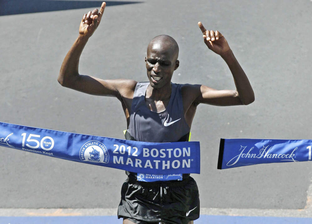 Wesley Korir of Kenya celebrates as he breaks the tape to win the 116th Boston Marathon in Boston, Monday, April 16, 2012. (Charles Krupa/AP)