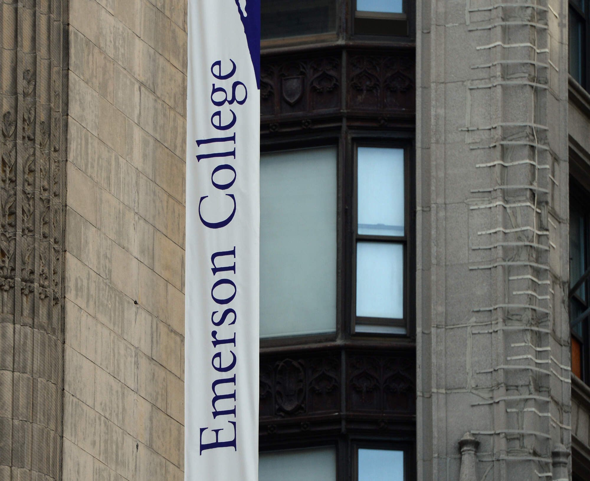 A vertical banner hangs on one of several buildings that make up Emerson College's downtown Boston campus at the corner of Boylston and Tremont Street. (Christopher Evans/MediaNews Group/Boston Herald via Getty Images)