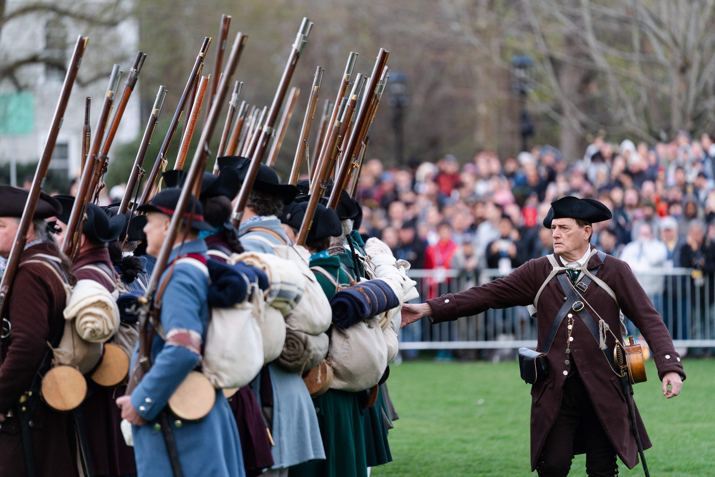 Reenactors depicting members of the Lexington Minute Men have their weapons checked after the 250th reenactment of the Battle of Lexington. (Sophie Park/Getty Images)