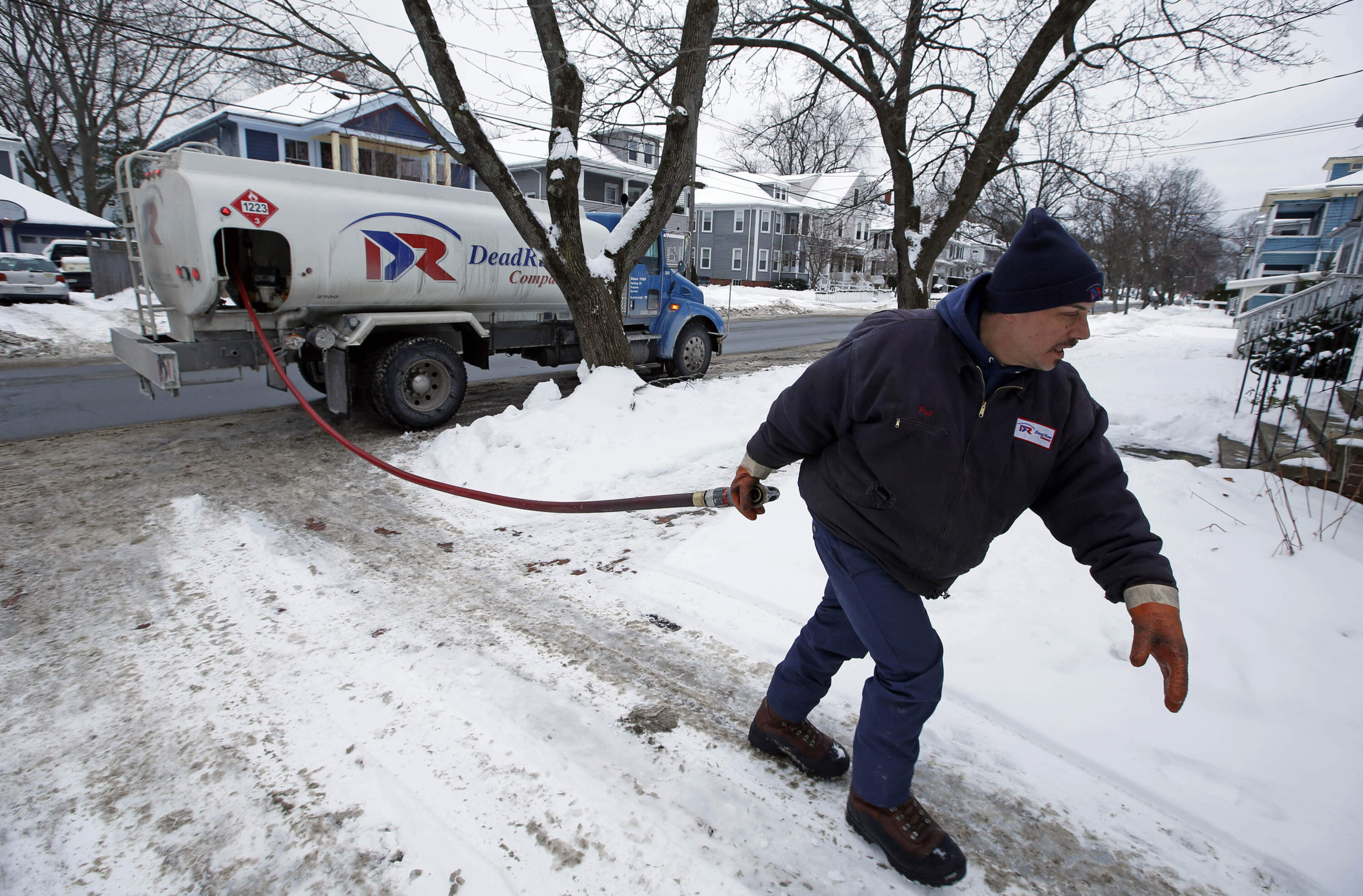 A driver for the Downeast Energy delivers heating oil to a home in Portland, Maine, Jan. 14, 2015. (Robert F. Bukaty/AP)