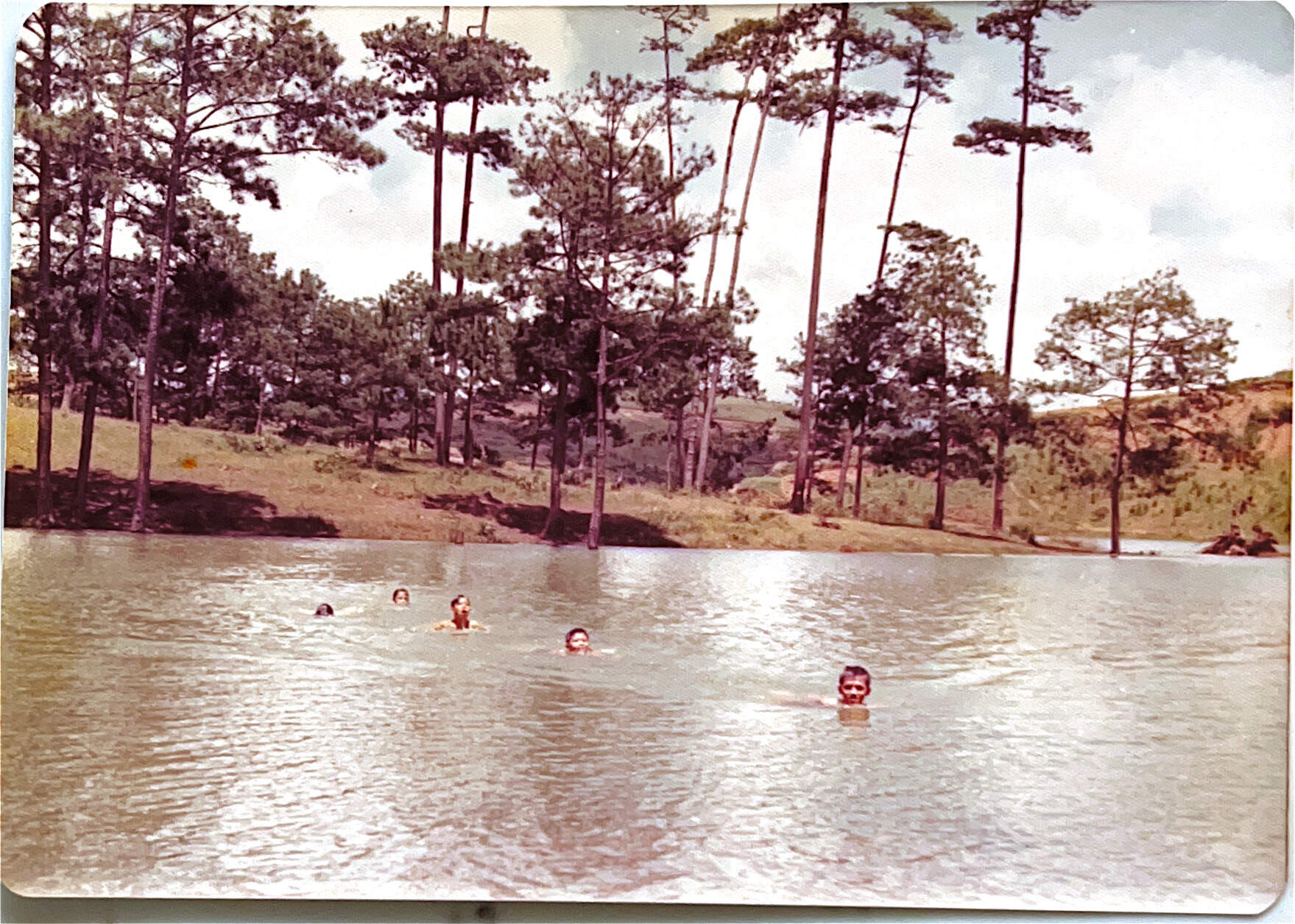Several Truong Le siblings swimming in Tây Ninh, Vietnam. (Courtesy of Mai Le and the Truong Le family)