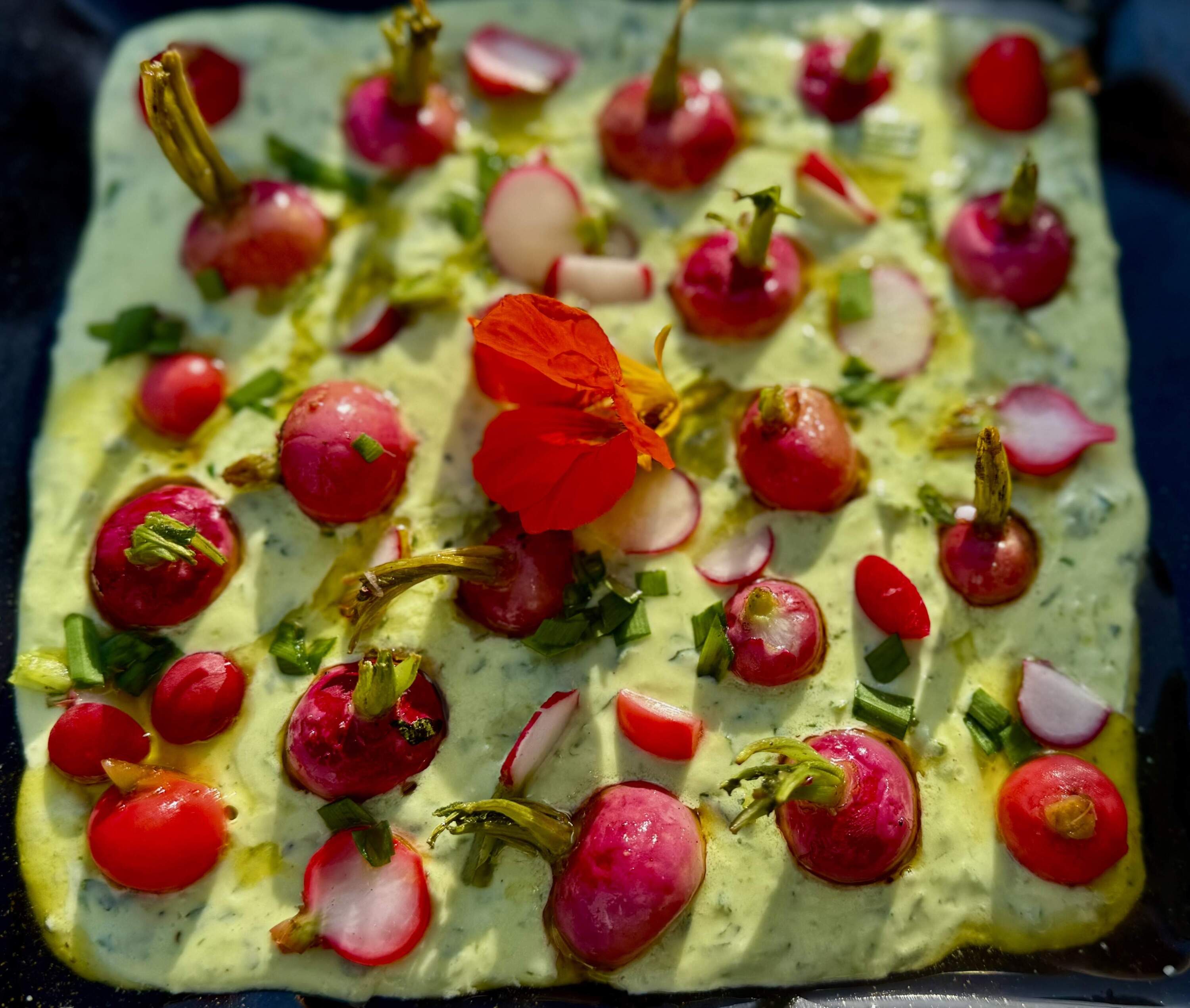 Radishes three ways with green yogurt sauce. (Kathy Gunst/Here &amp; Now)