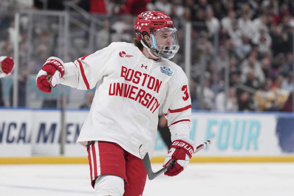Boston University's Cole Eiserman (34) celebrates after scoring during the second period in a semifinal game Thursday, April 10, 2025. (Jeff Roberson/AP)